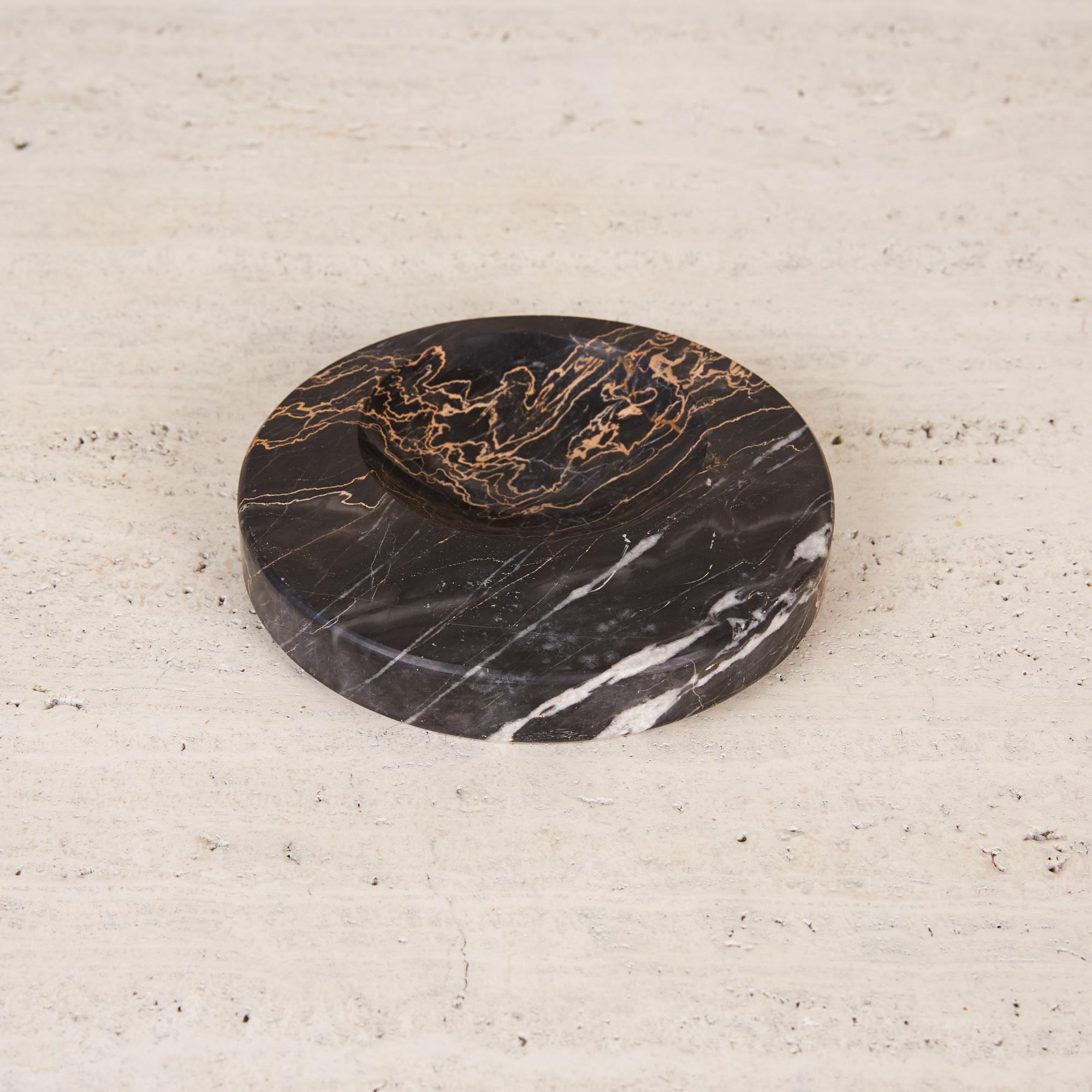 Sergio Asti style black marble bowl, Spain, circa 1970s. The hand carved object is made from Nero Marquina marble, a black marble with bright contrasting veining that is indigenous to certain regions of Spain. It is reminiscent of the marble