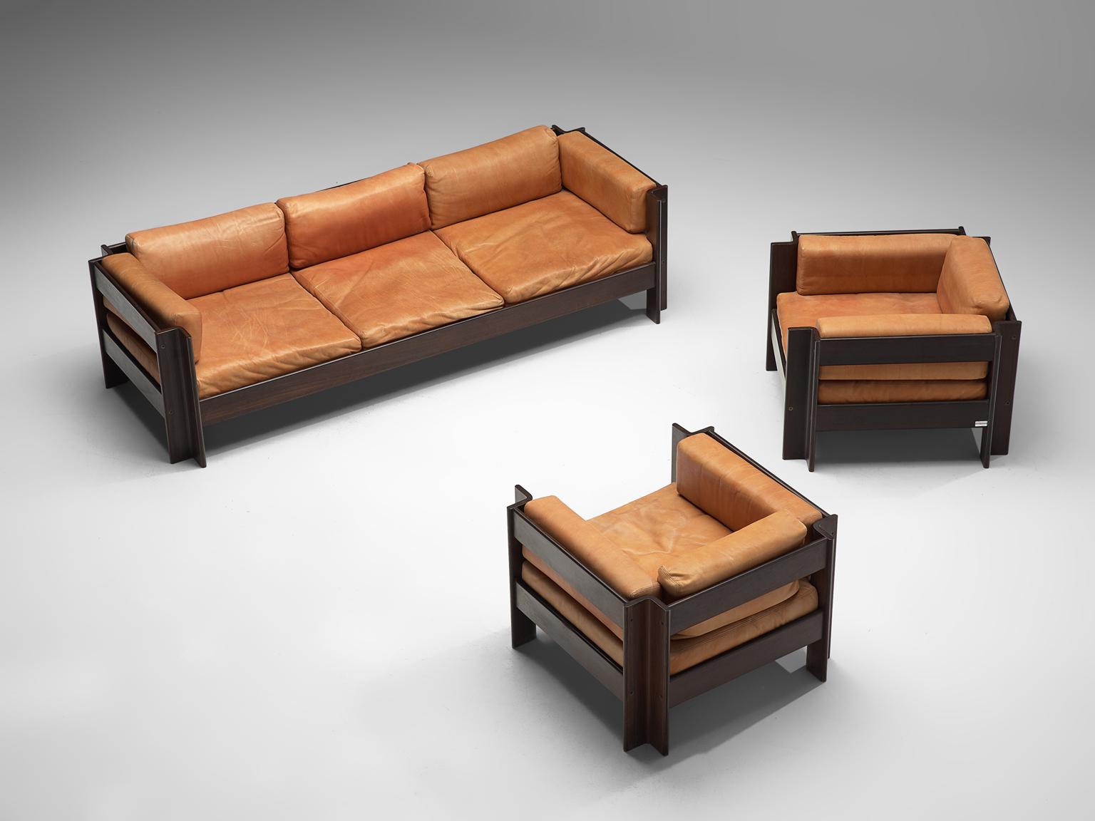 Sergio Asti for Poltronova, 'Zelda' living room set, leather and darkened wood, Italy, 1962.

Beautiful three seat sofa and two lounge chairs designed by Sergio Asti for Poltronova. The pieces of furniture are made with a dark wooden frame and