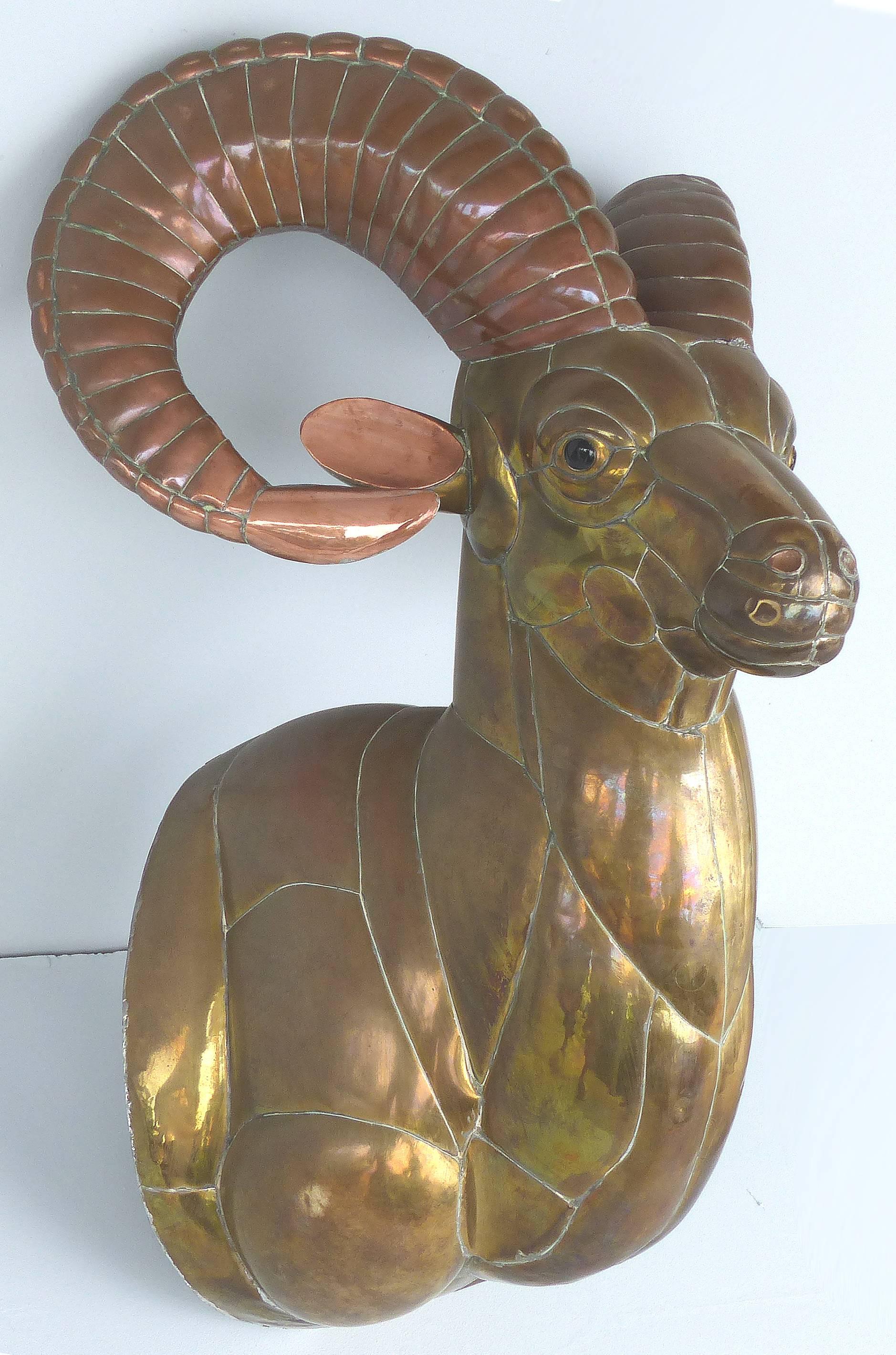 Sergio Bustamante 1970s Mexican mixed metals Ram's Head wall sculpture

Offered for sale is a large and impressive mixed metals wall sculpture by renowned Mexican artist Sergio Bustamente, circa 1970s. Bustamante was born in 1949 and lived most of