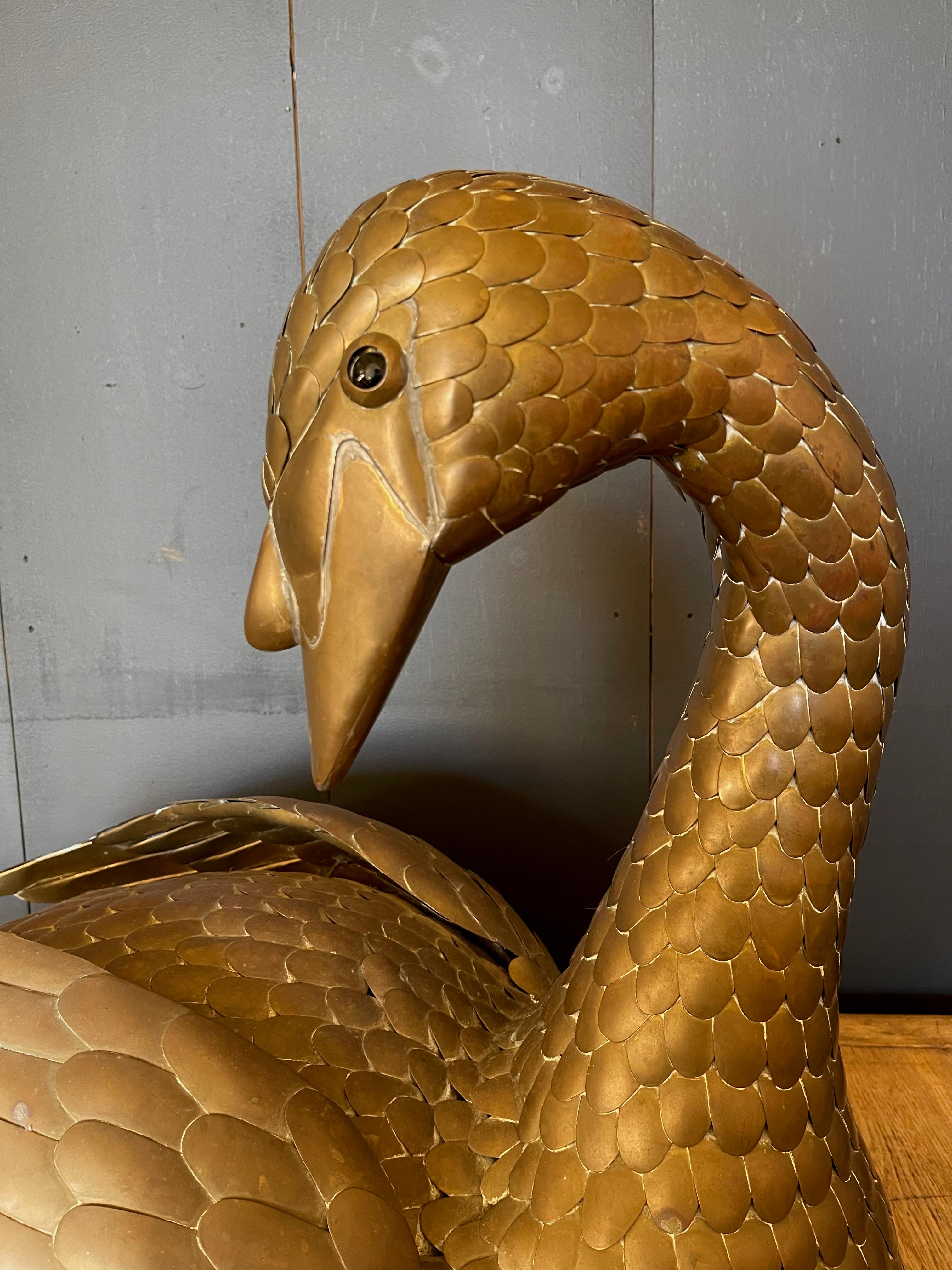 Enhance your space with the enchanting Sergio Bustamante Mid-Century Brass Swan Sculpture. Crafted by the esteemed Mexican artist, this piece embodies the timeless allure of mid-century design and artistic excellence. The swan's elegant figure,