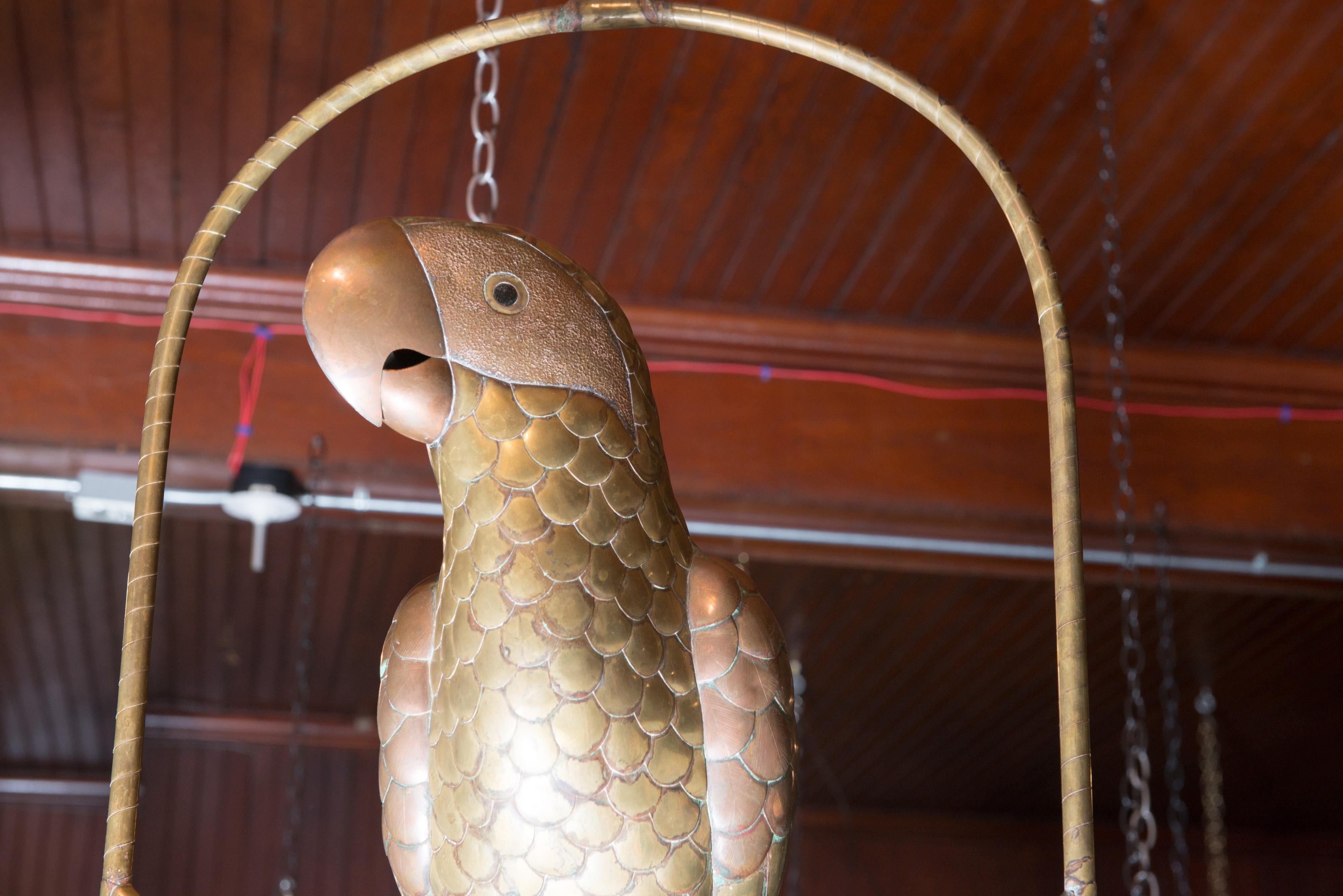 Bustamante brass parrot on a swing. Do not see a signature. In excellent condition.
Bird comes off swing for packing.