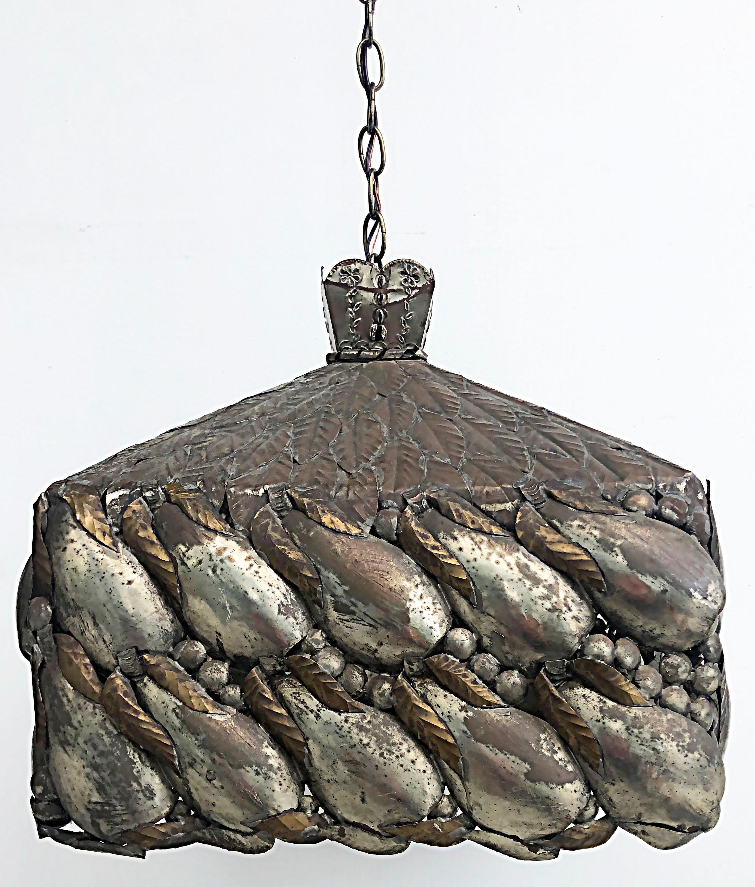 Sergio Bustamante Mexico signed light fixture, mixed metal.

Offered for sale is a Mexican mixed metal mid-century signed Sergio Bustamante hanging light fixture. The fixture is wired and in working condition. The standard socket accommodates a