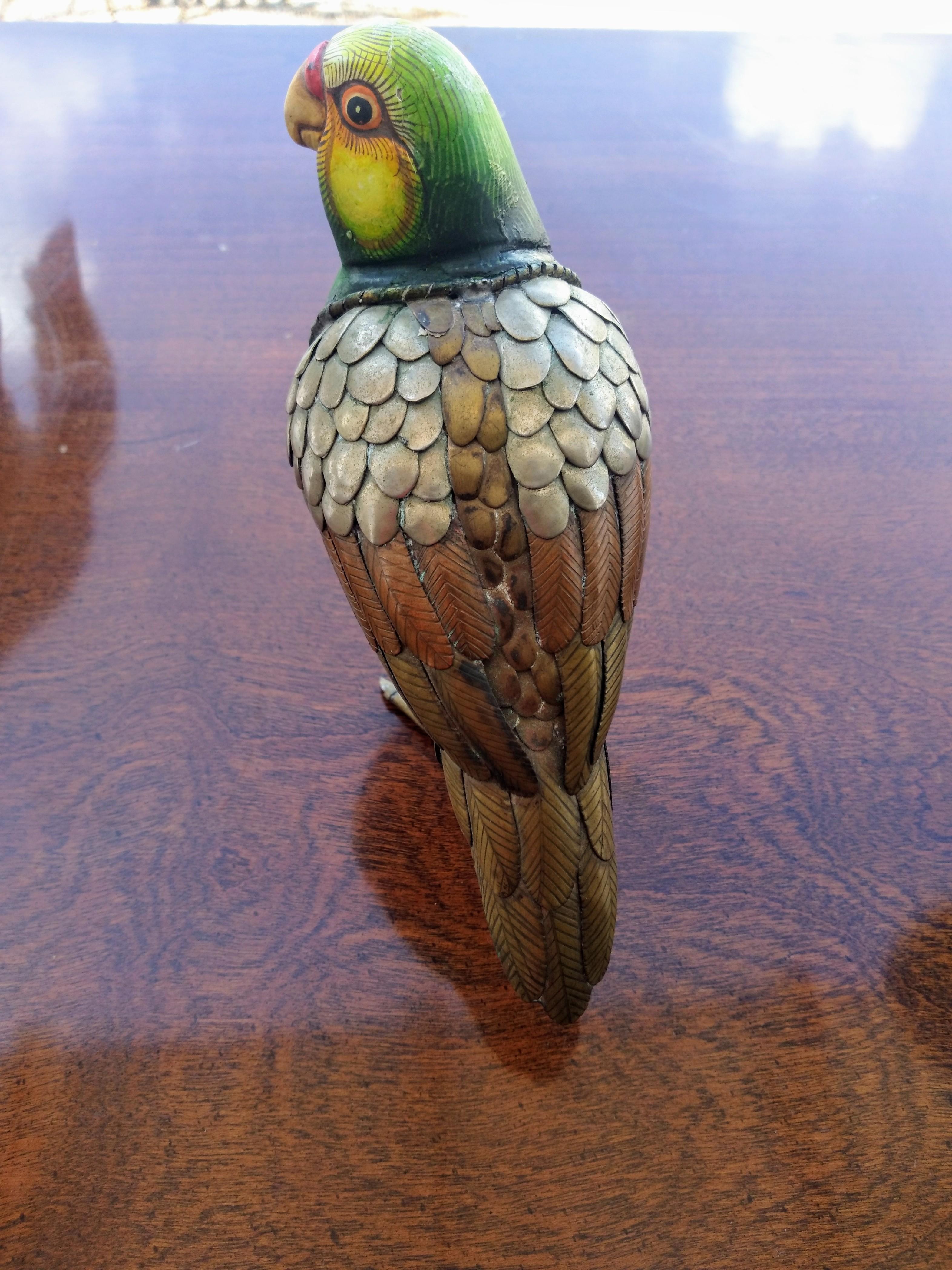 A wonderful example of Bustamante's ability to capture the essence of the being. The copper, bronze and metal accents captures the life like feathers. The hand painted ceramic breast and head are eloquently crafted. This is a nice addition to any