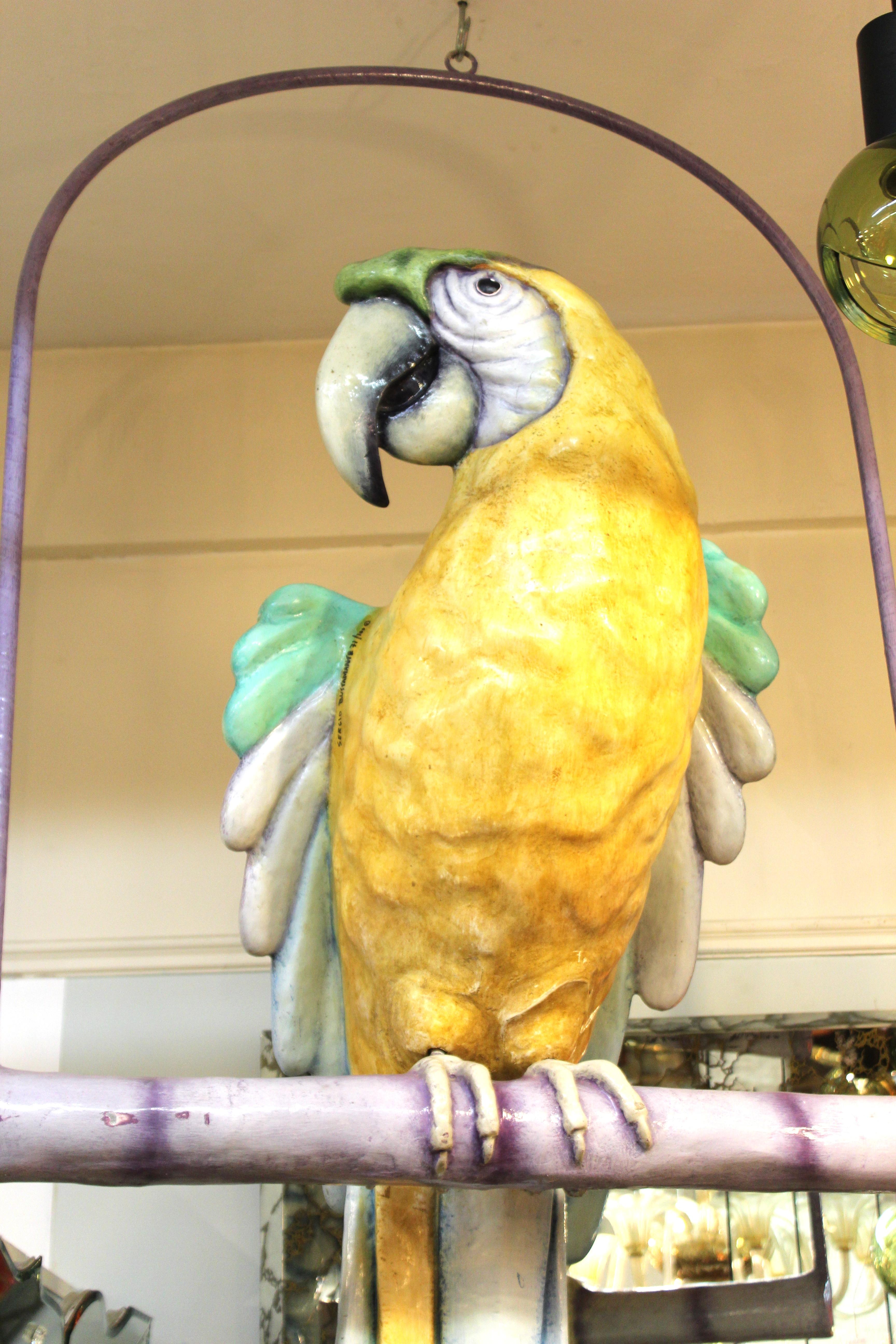 paper mache parrot on hanging perch