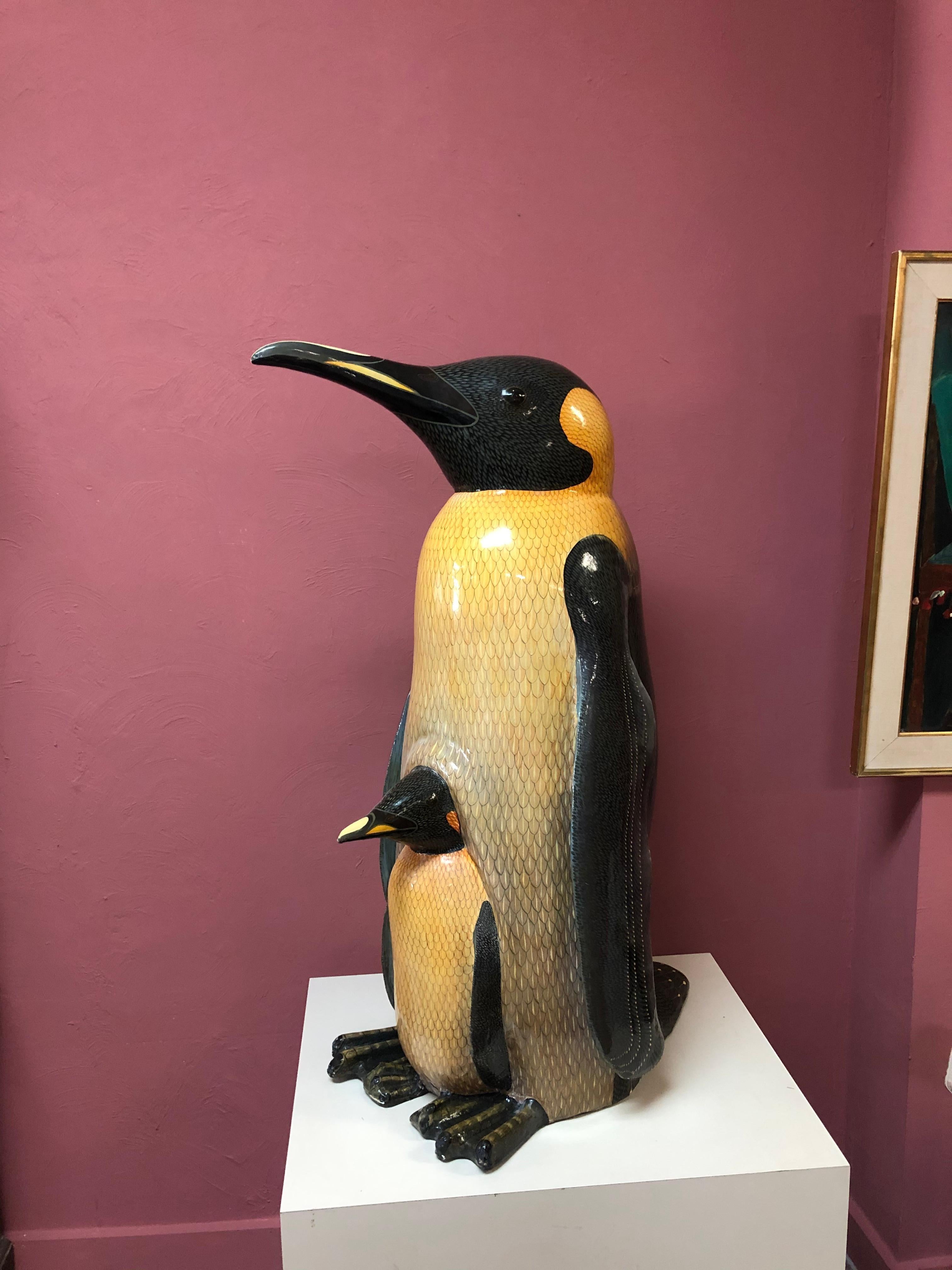 Fabulous Sergio Bustamante sculpture of mother Penguin with baby. This rarely available piece was made from paper mache and other materials. Probably created in the 1970s or 80s. He was born in 1942 in Sinaloa Mexico. He has had auction records