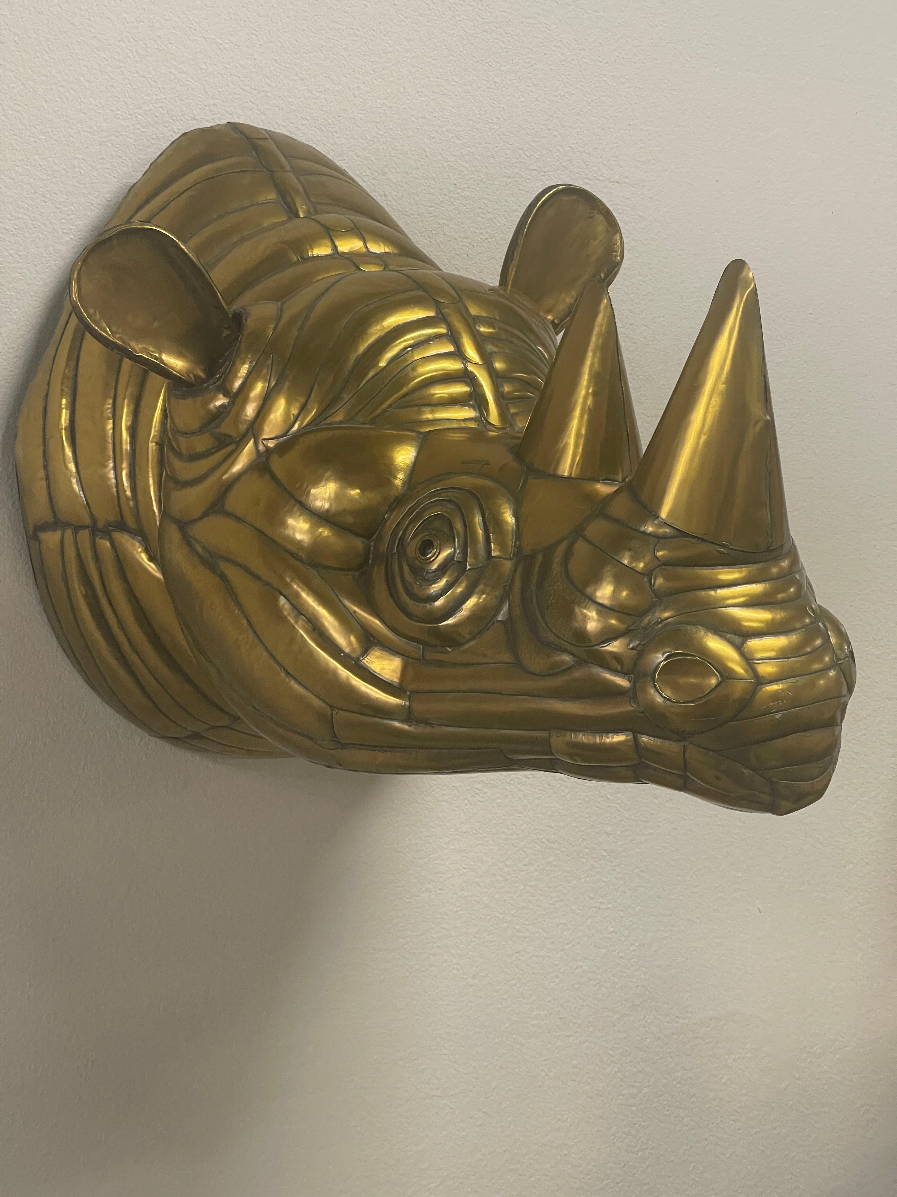 Wonderful brass life size Rhinoceros by Sergio Bustamante. It is not signed but was purchased at a gallery in Mexico in the 1980’s. We had a nice collection of animals along with this one with certificates, none of which were signed. The certificate