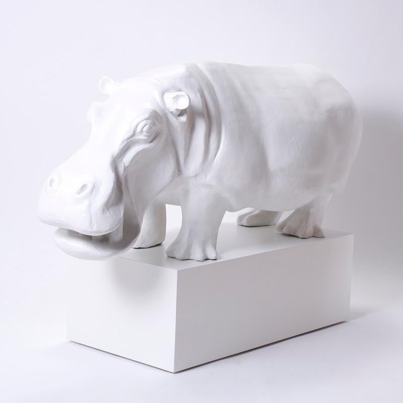 A very fun and decorative papier mâché hippopotamus by Sergio Bustamante, complete with custom pedestal. Very light and easy to handle, this hippo adds humor and taste to any room. White paint is a later addition. 
