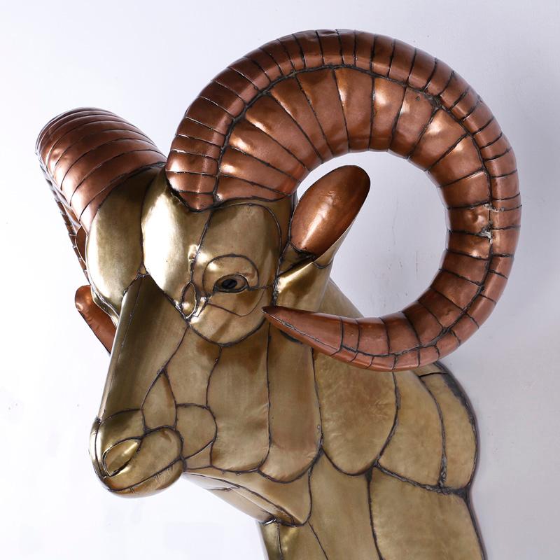 Bold and inspired Bustamante sculpture portraying a ram's head, crafted in copper and brass pieces that are welded together in a rather impressive puzzle.