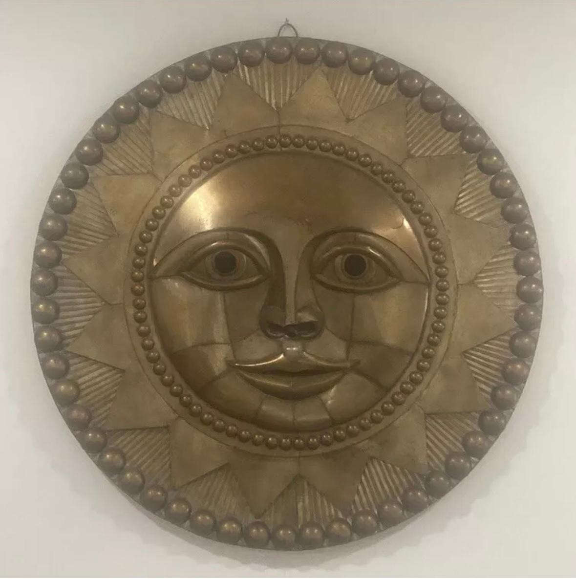 "Faccia da sole" - Sculpture di Sergio Bustamante