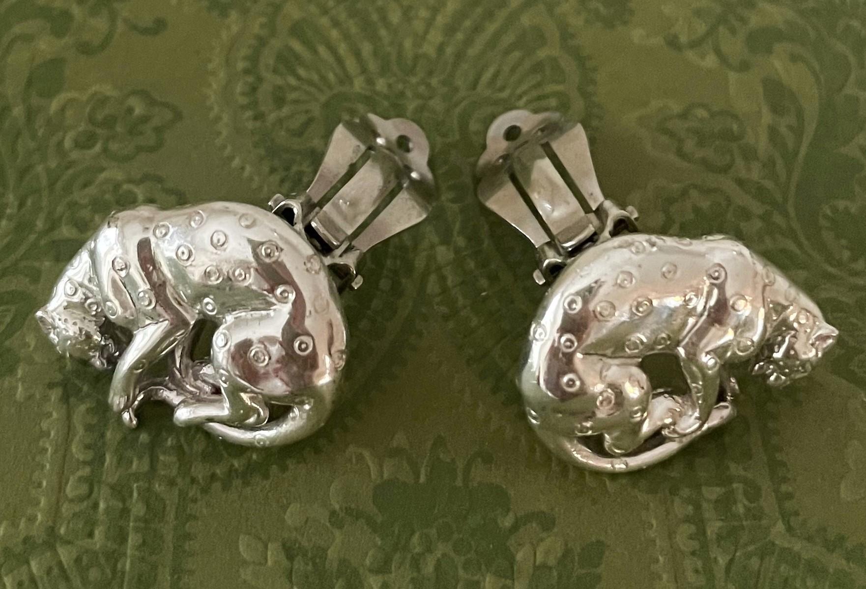 Very rare and one-of-a kind Sergio Busamente Earrings. These sterling earrings show a leopard.  Engraved Mex 927 on one and the full Sergio Bustamante script signature on the other. They are handmade and are in excellent condition. 
Sergio
