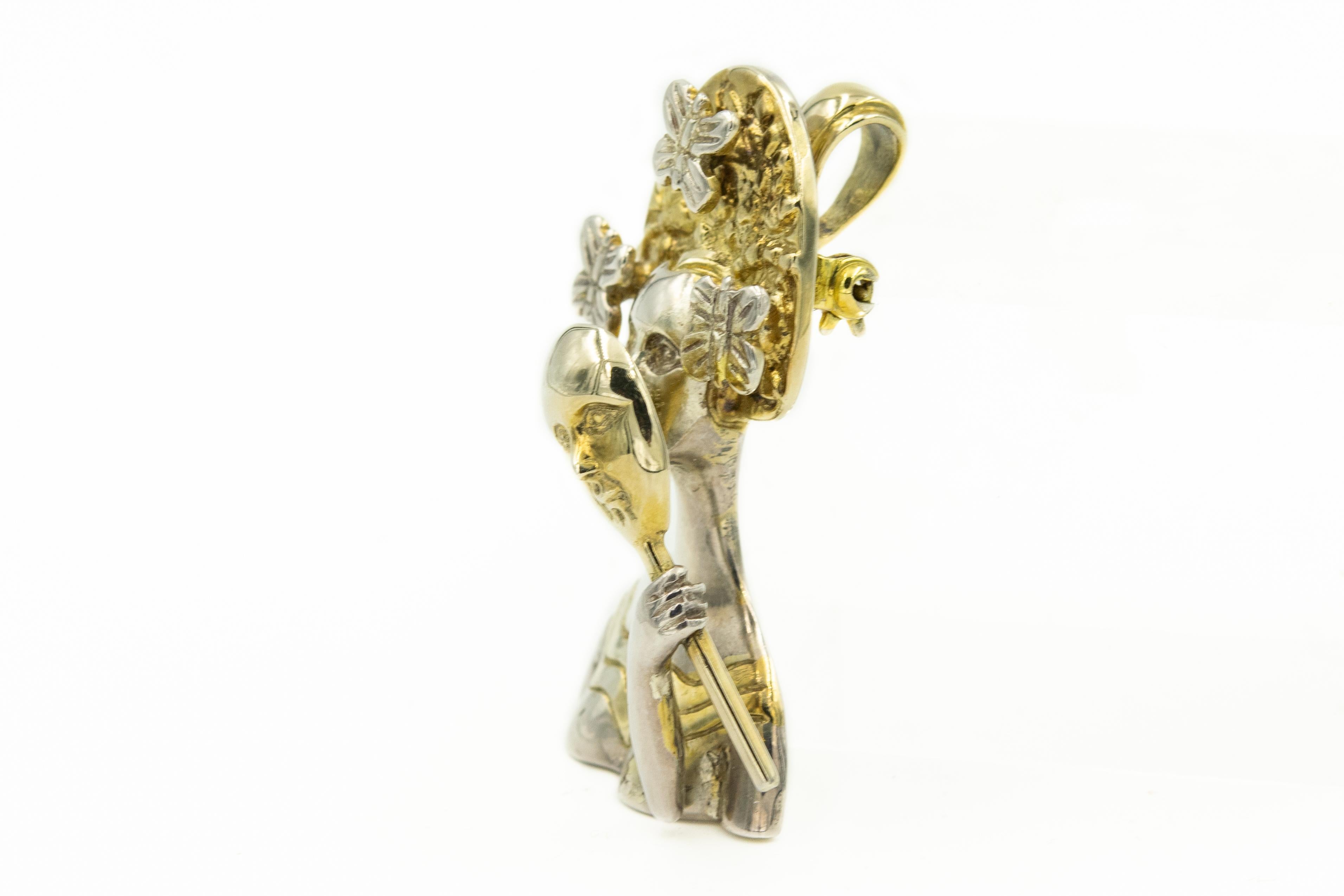 Stunning signed by artist Sergio Bustamante sterling silver and gold vermeil (24k god plating) pendant brooch. The pendant depicts the bust of a surreally beautiful woman with butterflies around her head holding a masquerade type mask in front of