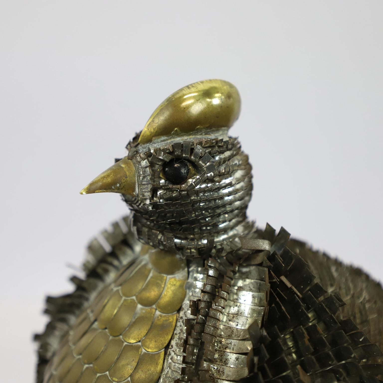 Circa 1970. We offer this Sergio Bustamante style mixed metal Peacock sculpture. With his graphic design of curled metal going in different directions around his body this sculpture is a perfect piece for any midcentury collection. Great volume and