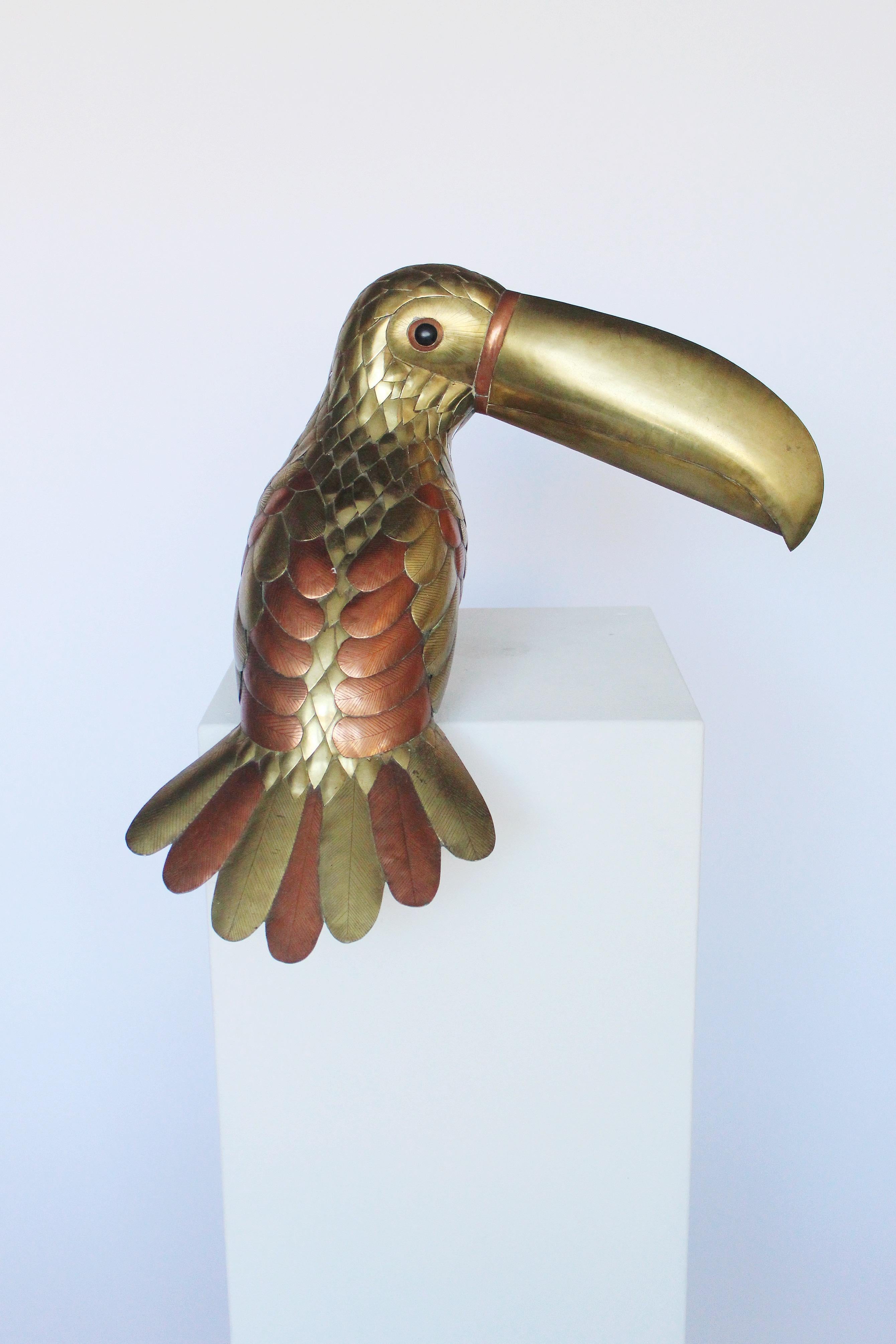 life-size brass and copper Sergio Bustamante Folk Art Toucan parrot in excellent condition and beautiful Patina. 

 Though born in Culiacan, Sinaloa, Mexico, Sergio Bustamante has lived in the Guadalajara area since early childhood. In his youth,