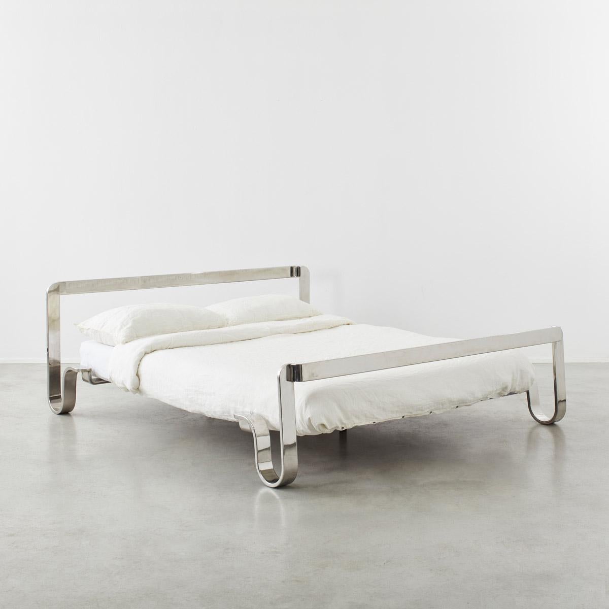 Ribbons of stainless steel unfurl into a sinuous bed frame, designed by Sergio Chiappa-Cattò, Angelo Cortesi & Carlo Torrigiani Aucuba. Its lithe form is minimalistic, but the polished metal speaks of science and the technological triumphs of the