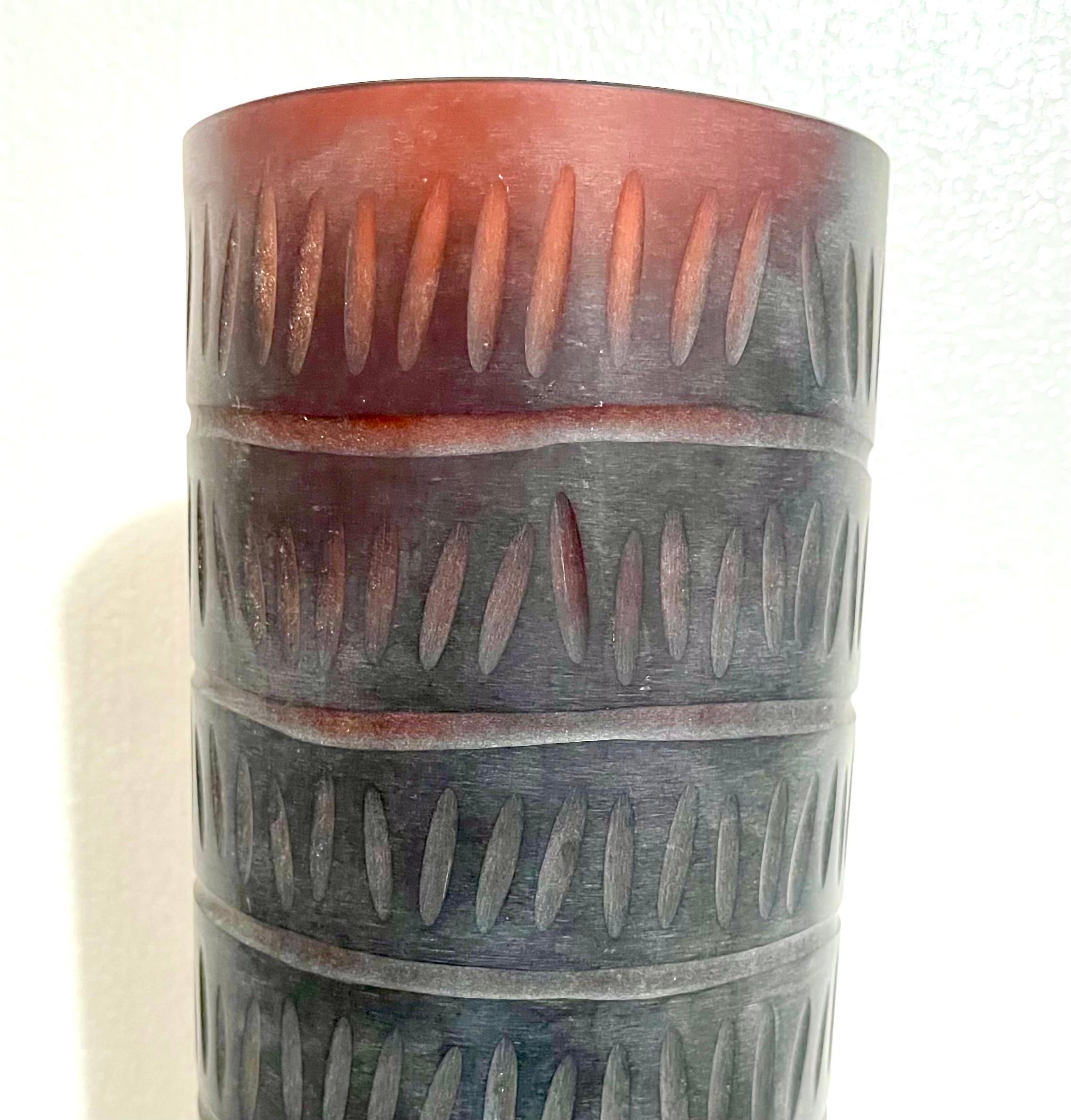 Marcello Panza for Arcade Vase (this is for 1 of a pair I have, I am selling them separately). This has an African or Aboriginal tribal pattern to it. 
Hand etch signed on underside, hand blown, tall black oval vases having hand cut design to