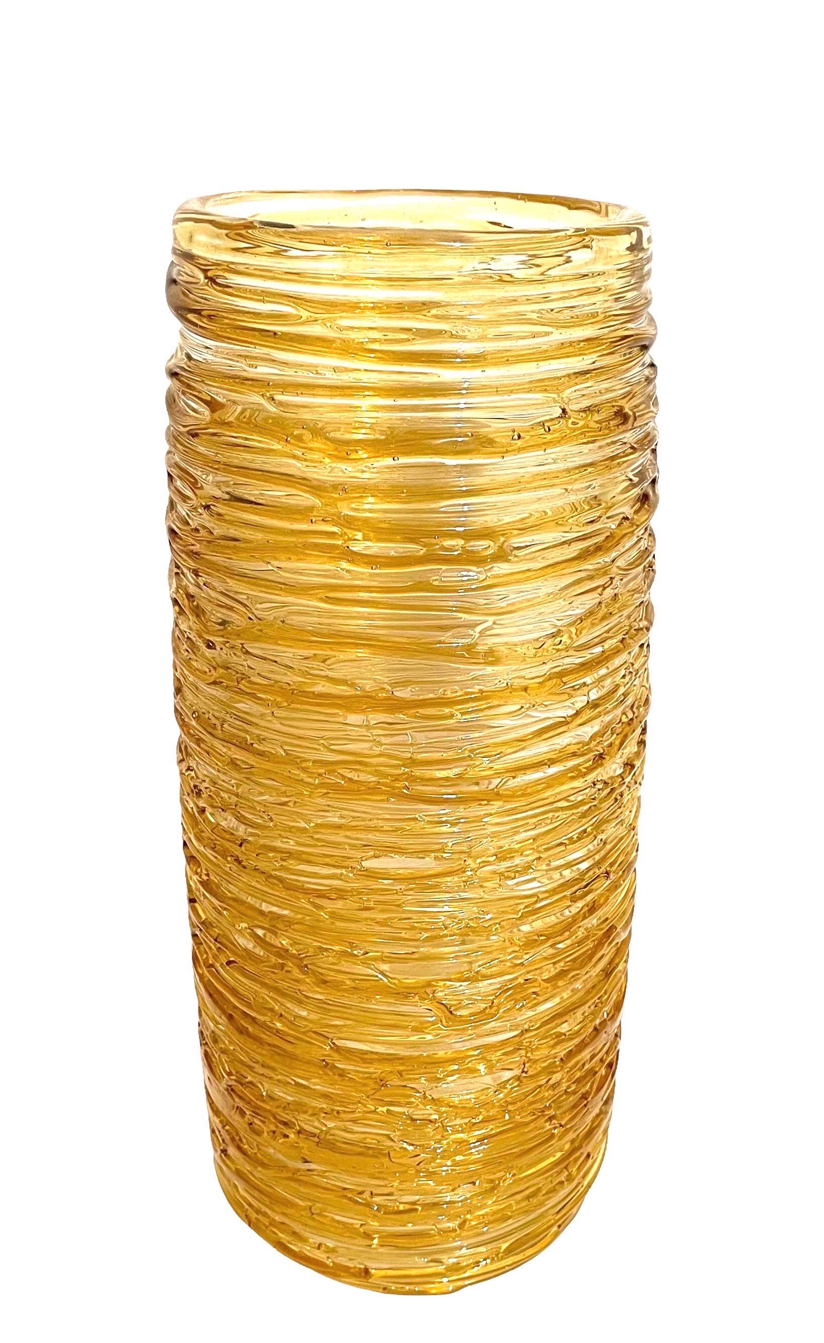 

Dimensions: 12.5 X 5.25 X 5.25 in
The organic shaped vase showcases an applied light gold colored threaded design enveloping the clear body, around. Hand signed Constantini S. It came from an important estate in the Palm Beach area.
Made in