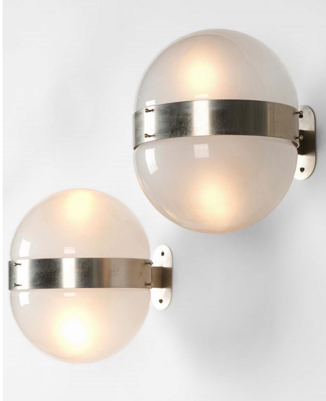Sergio Mazza, pair of wall lamps, nickel-plated brass structure and frosted glass diffusers.Prod. Artemide, Italy, 1963

This is a pair of lamps of great charm, rare and refined, capable of furnishing your home environment with style and