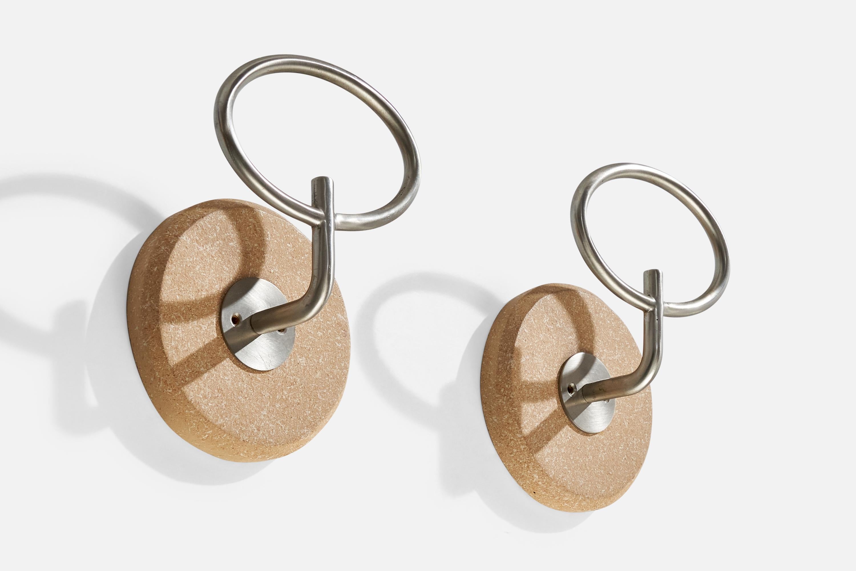 A pair of steel coat hangers designed by Sergio Mazza and produced by Artemide, Italy, c. 1960s.

Dimensions: 7.75” H x 5.6” W x 3.2” D