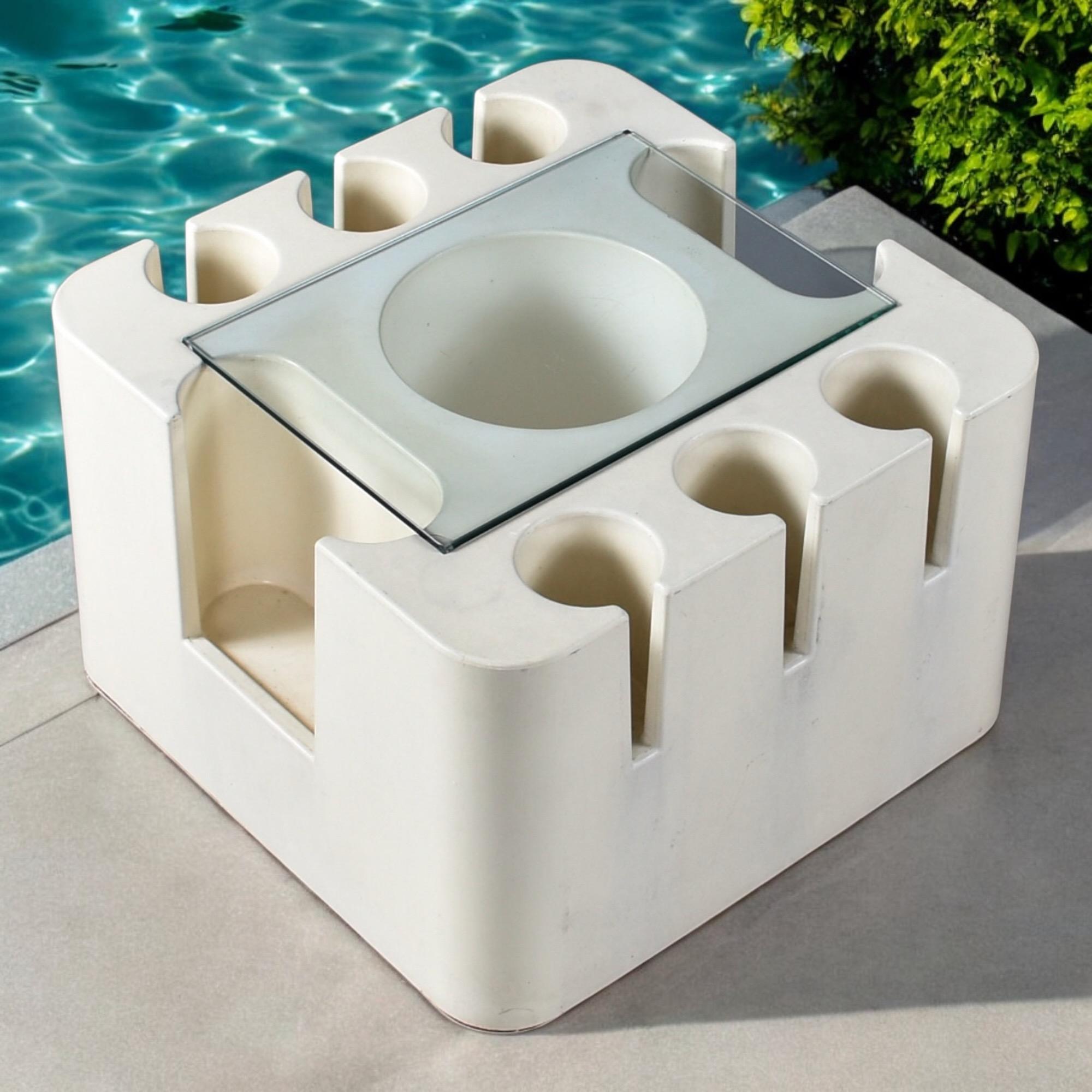The “Bacco” bar cart, designed by Sergio Mazza for Artemide in the late 1960s, is a space-age masterpiece of Italian design—playful, sculptural, and wholly functional. Cast from molded ABS plastic, the cube-shaped piece stands at a compact yet
