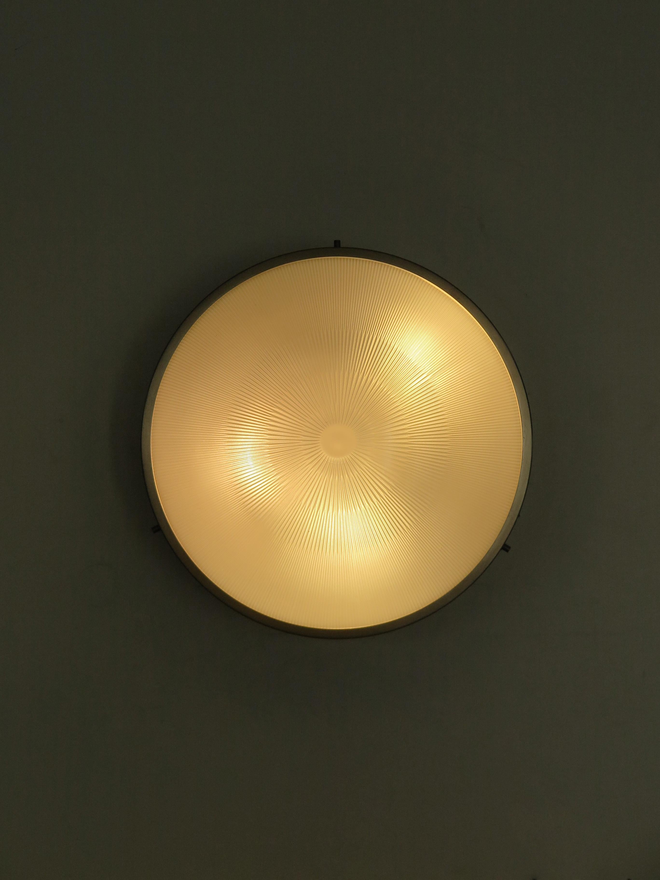 Italian midcentury modern design sconce wall light or ceiling lamp model Sigma designed by Sergio Mazza and produced by Artemide with nickel-plated brass structure and molded glass bowl, Italy 1960s. 

Please note that the lamp is original of the