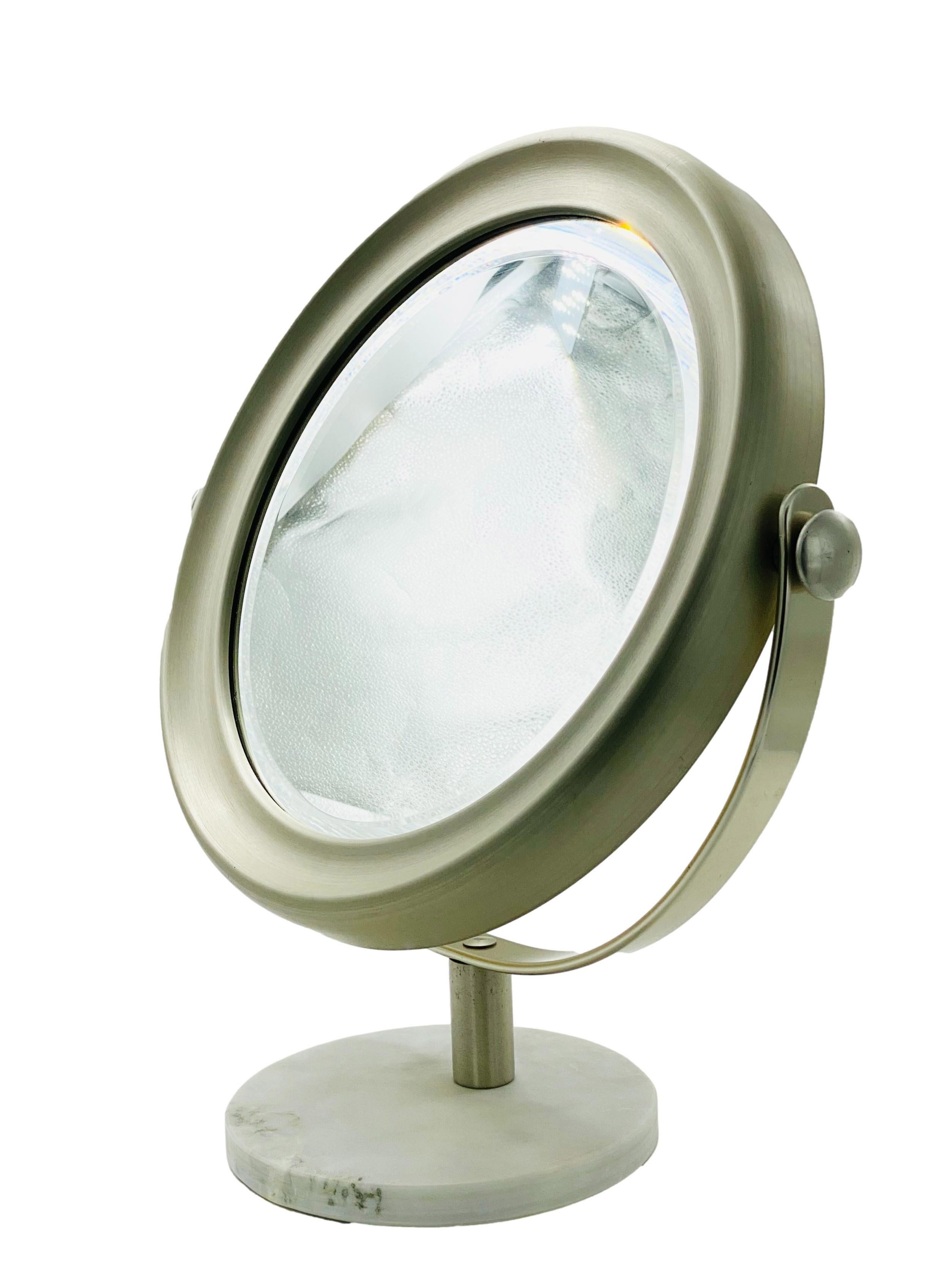 Table mirror Mod. Narciso designed by Sergio Mazza for Artemide, Italy 1976 with white marble and nickel-plated brass base.