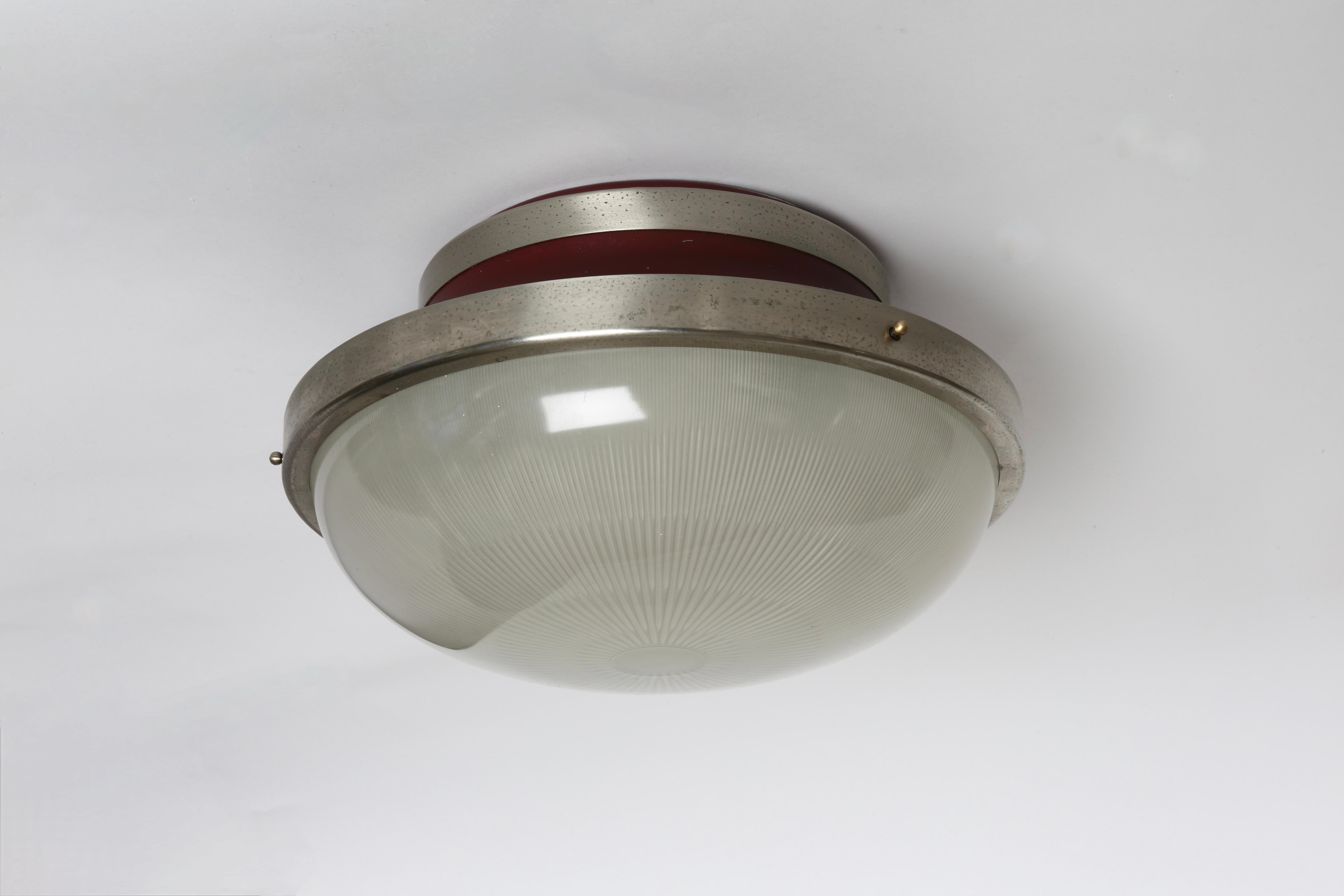 Sergio Mazza for Artemide  flush mount ceiling light
Nickel plated brass, holophane glass.
Italy, 1960s.
Takes 3 medium base bulb.
Complimentary US rewiring upon request.
Some oxidation to the nickel plating and some losses to enamel.
See