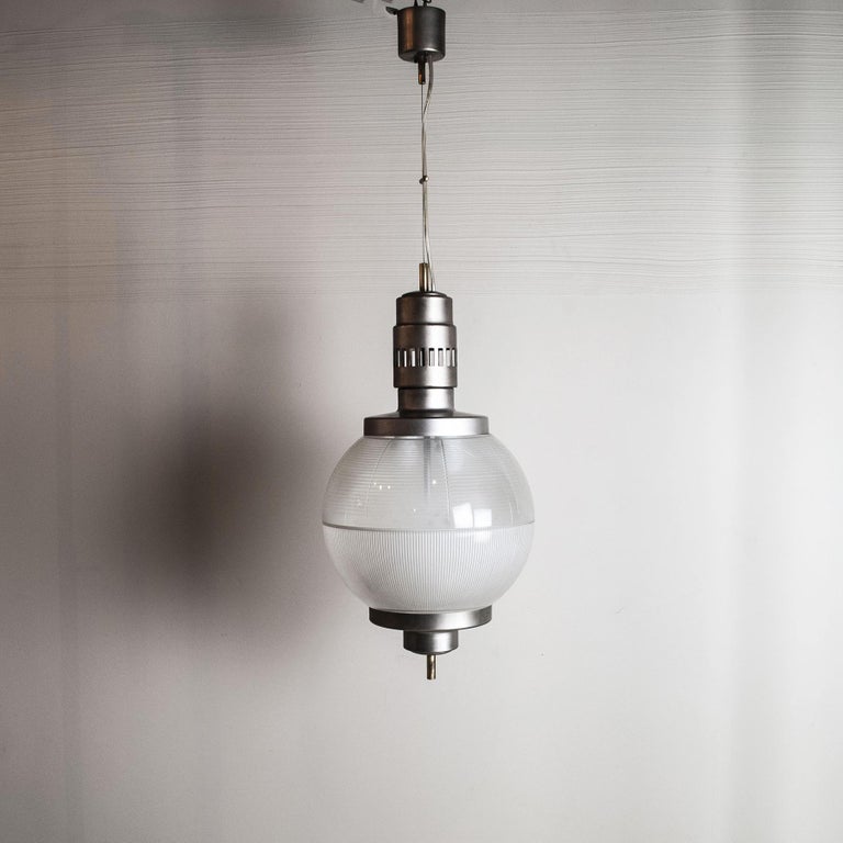 Suspension lamp in satin-finish chrome-plated aluminium and sphere in opaline and worked glass, designer Sergio Mazza, production 1960s.

n.b. adjustable height