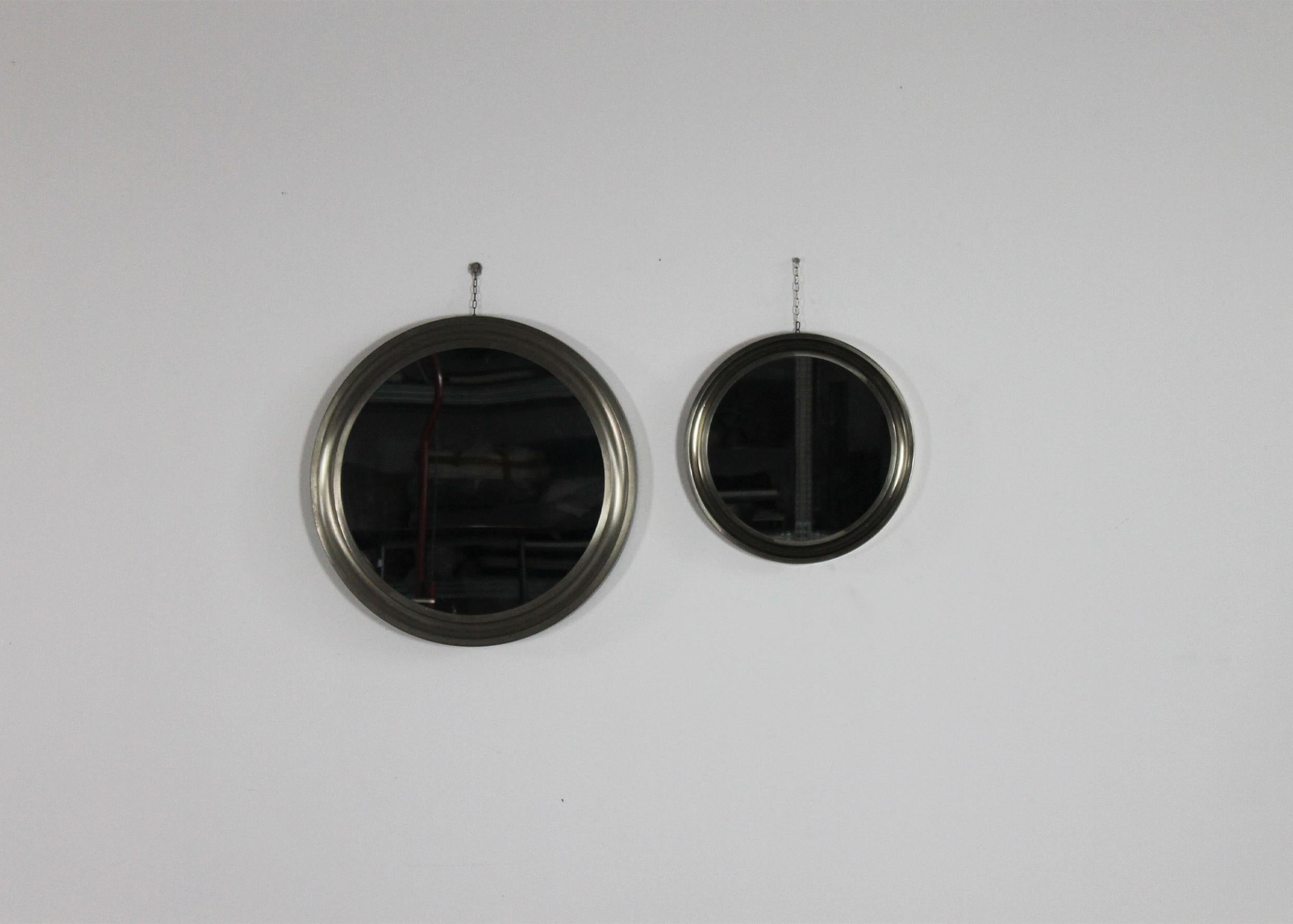 Set of two round-shaped wall mirror model Narciso with frames in brushed nickel-plated brass and mirrored crystals. 

The Narciso mirror can be mounted on the wall thougth the chains applied on the back.

Designed by Sergio Mazza and manufactured by