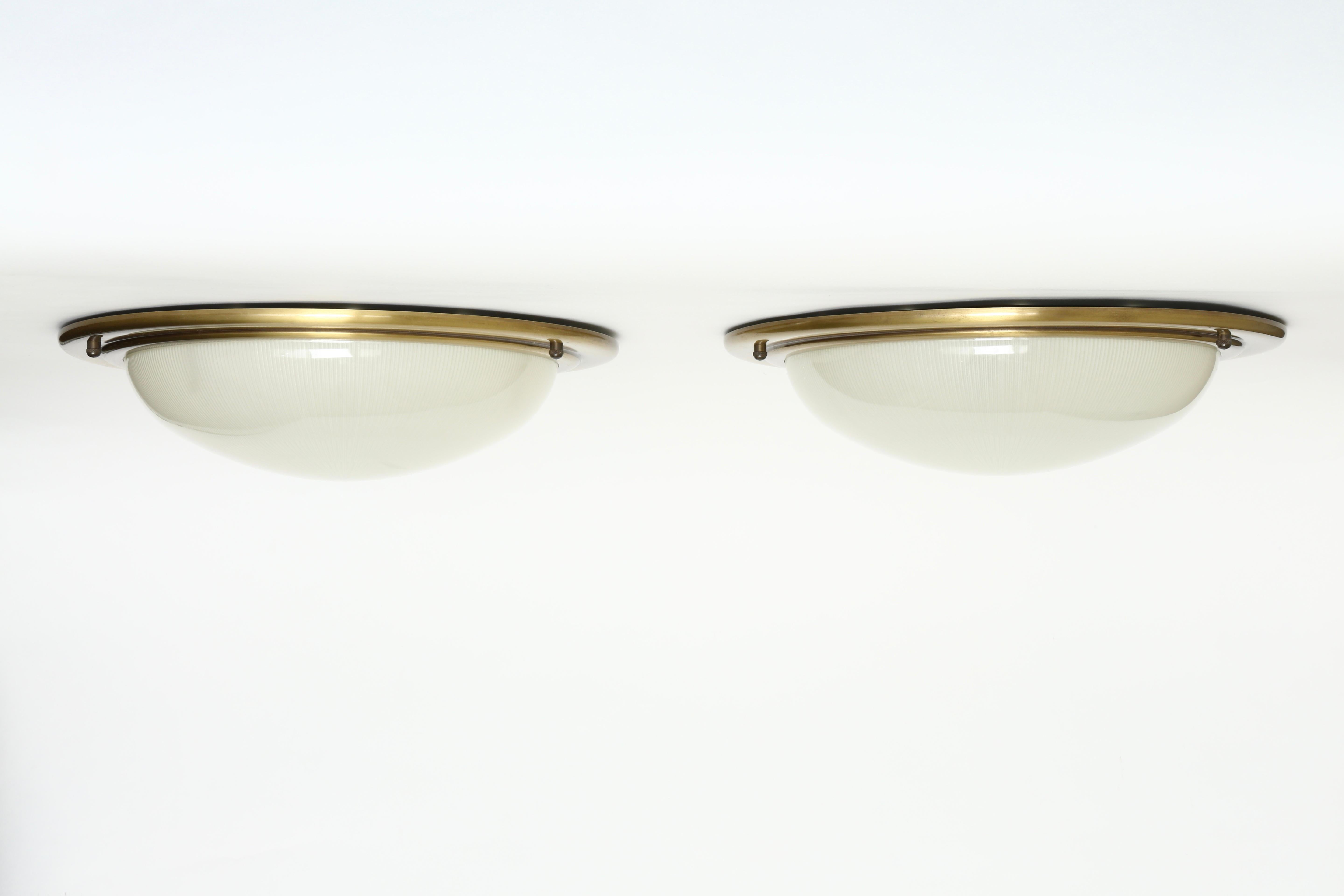 Sergio Mazza style flush mount
Brass, ribbed glass.
Italy, 1960s.
Available as a single or a pair.
Price for one item.
Three flush mounts available.
      