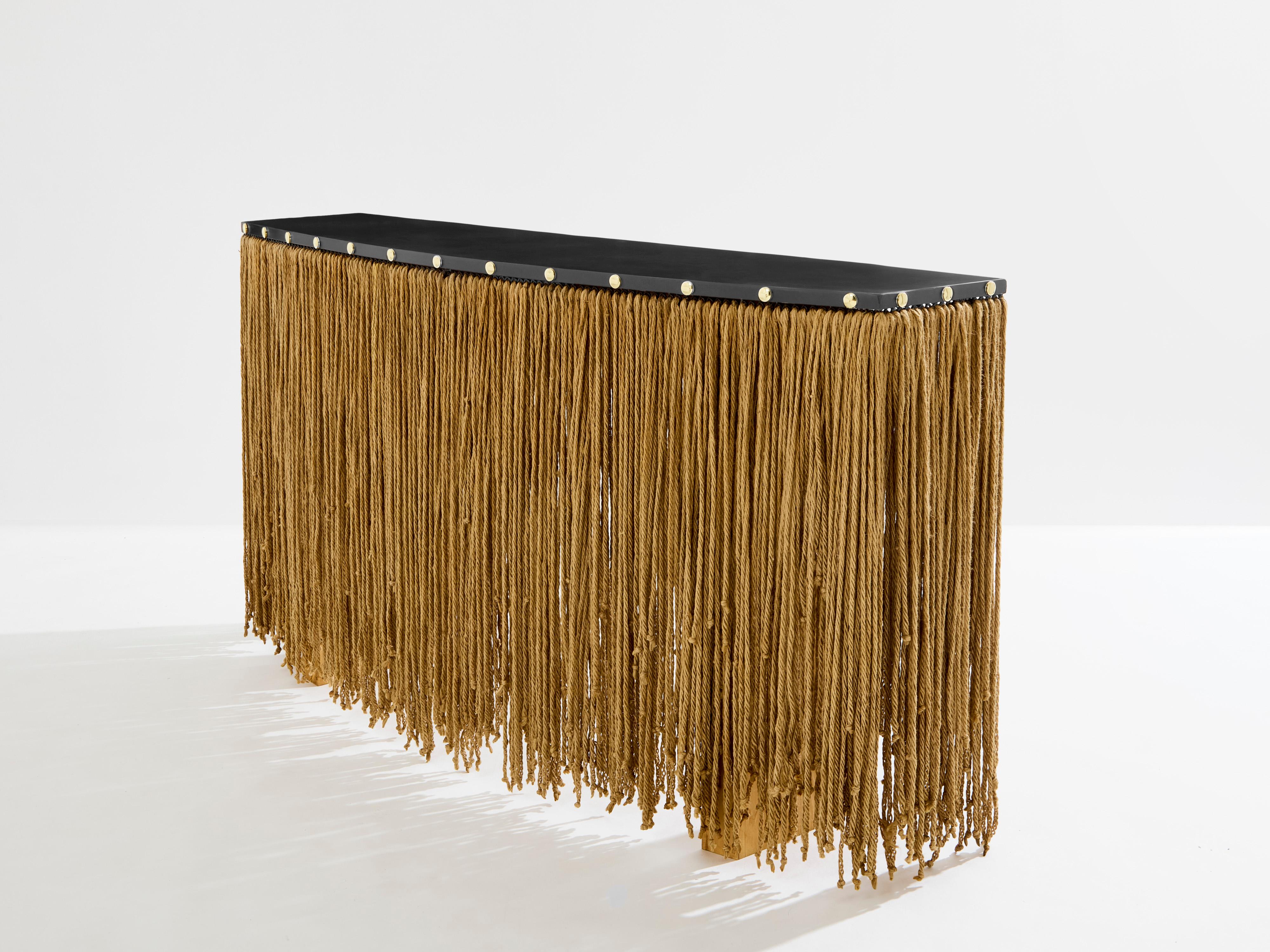 Unique sculpture console table by Sergio Ponzio IV created in the early 1970s in Italy. The console top and frame is made of patinated metal, with two large wood feet, and ropes covering them all around the console. This is a very unusual and