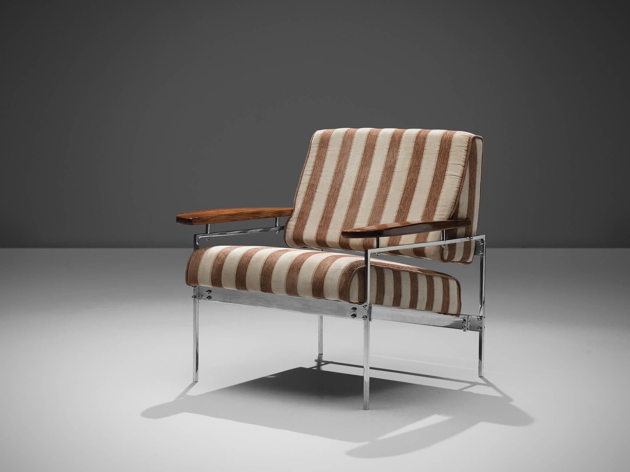 Sergio Rodrigues, 'Beto' armchair, chrome steel, wood, brown beige striped fabric, Brazil, 1958.

This 'Beto' armchair is designed by Sergio Rodrigues. The chair features a chrome steel frame, a brown beige striped fabric and wooden armrests. The