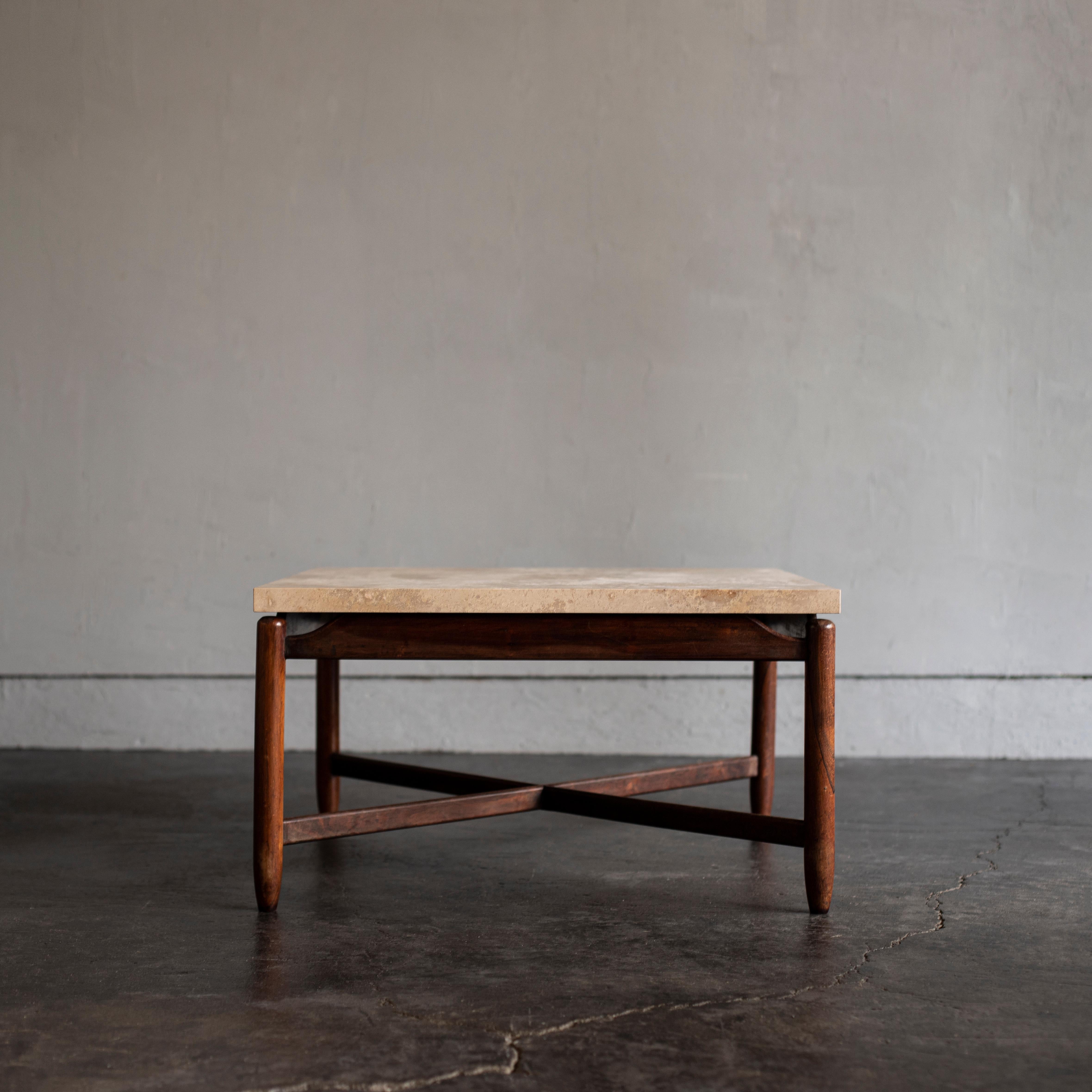 Coffee table designed by Sergio Rodrigues in 1950s.
Vintage legs are made with solid hard wood and the limestone top is new.
  