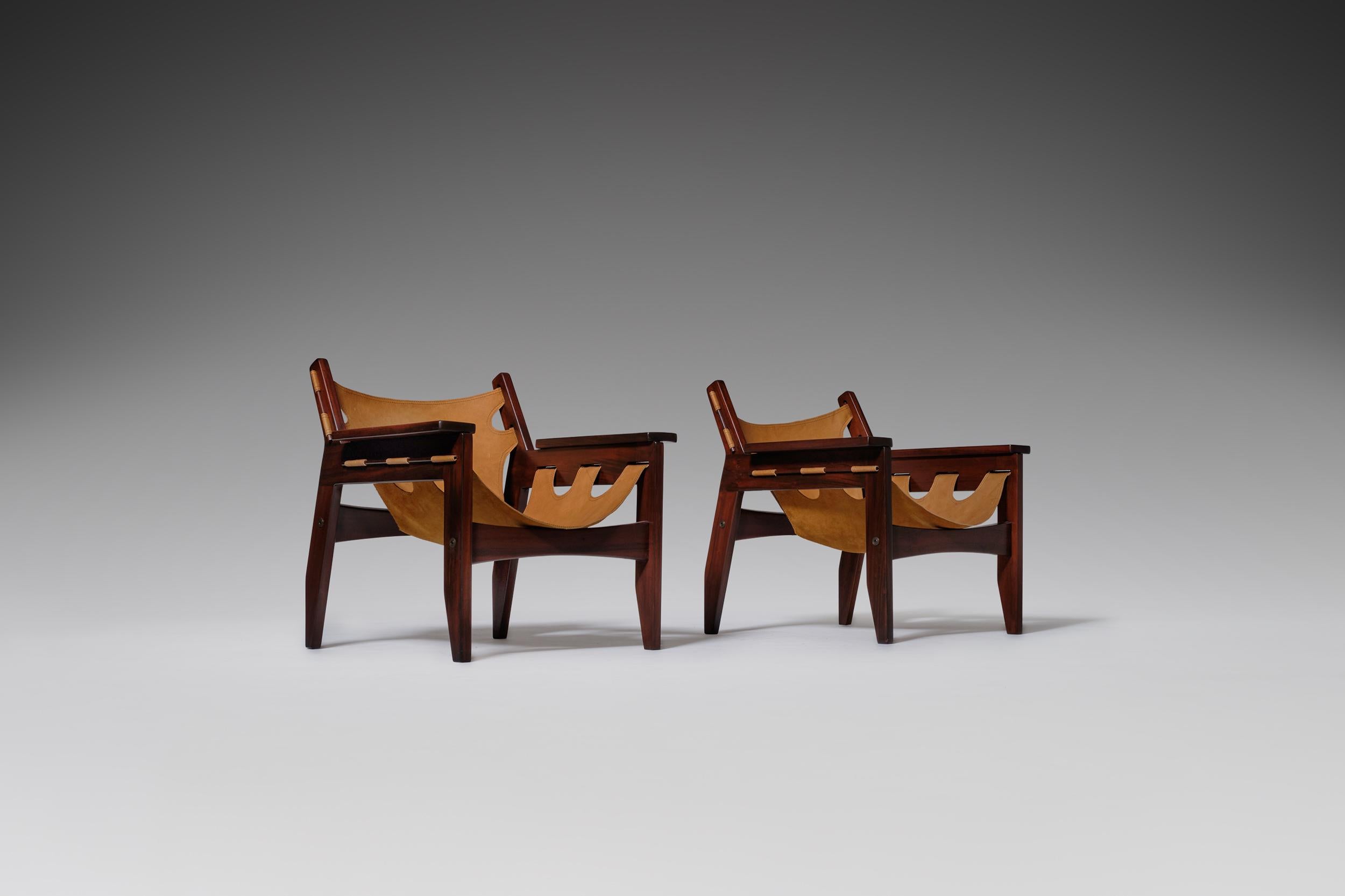 Beautiful pair of ‘Kilin’ lounge chairs by Sergio Rodrigues for Oca, Brazil, 1973. Distinctive design out of solid rosewood and natural ochre colored leather with a beautiful patina. Very elegant and comfortable armchairs in excellent condition.