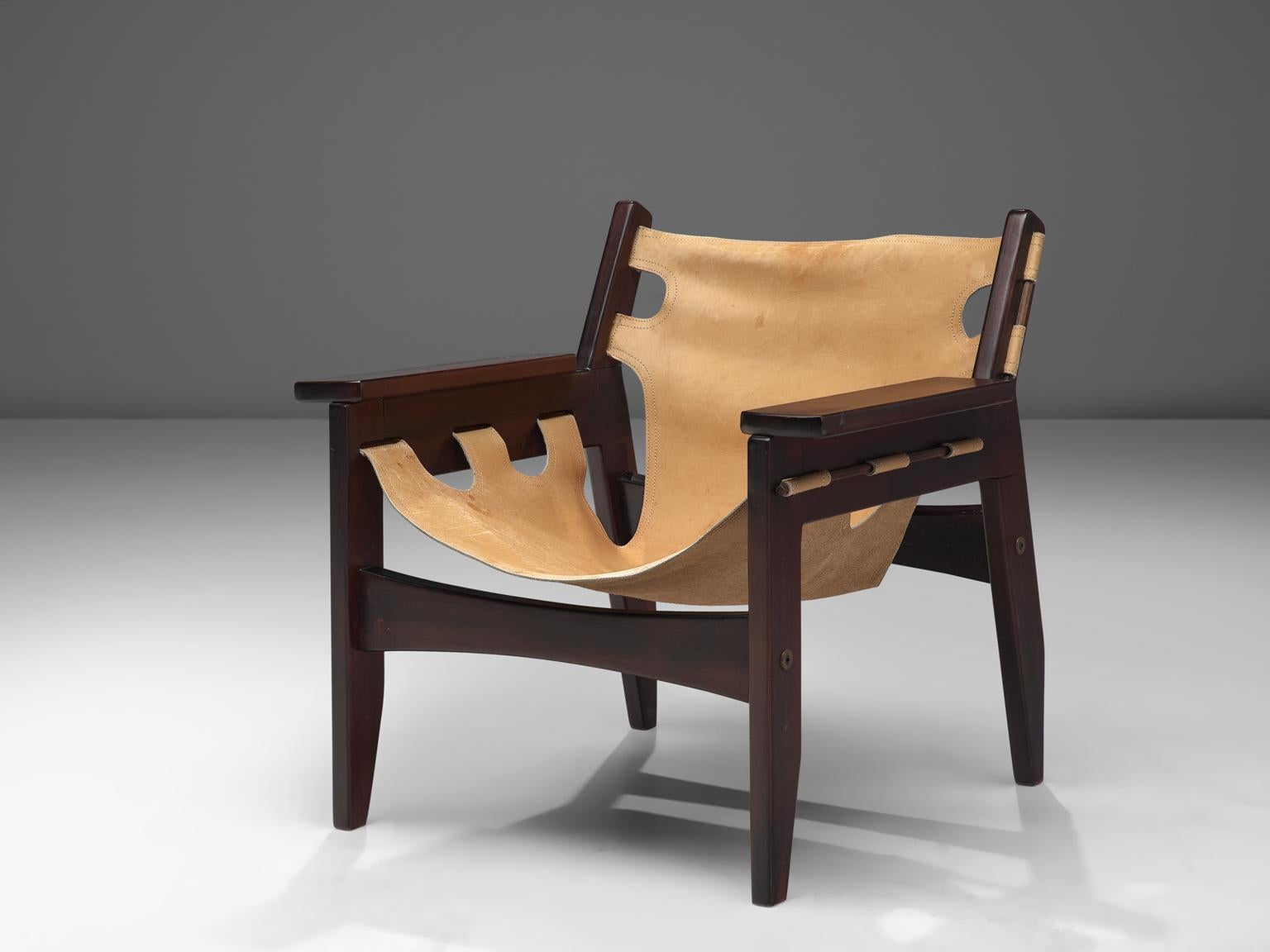 Sergio Rodrigues for OCA, pair of 'Kilin' armchairs, rosewood and leather, Brazil, 1973. 

'Kilin' easy chair in Jacaranda rosewood and beige leather. This chair has a sturdy appearance and is designed with high attention to detail. The thick