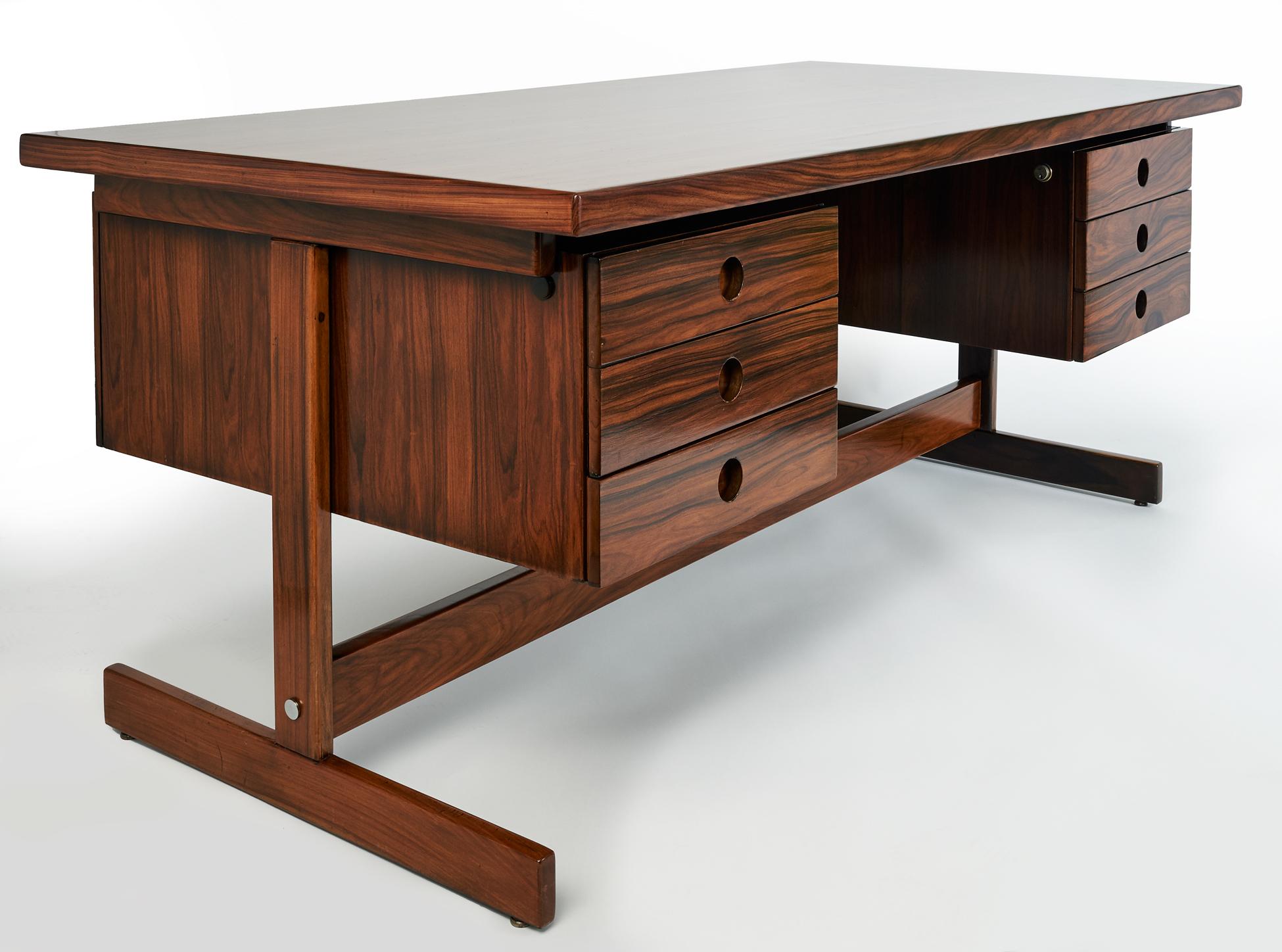 Sérgio Rodrigues (1927–2014)

An imposing and stately floating desk in sumptuous jacaranda wood with contrasting chrome-plated steel details by modern Brazilian design pioneer and frequent Oscar Niemeyer collaborator Sérgio Rodrigues. Dubbed the