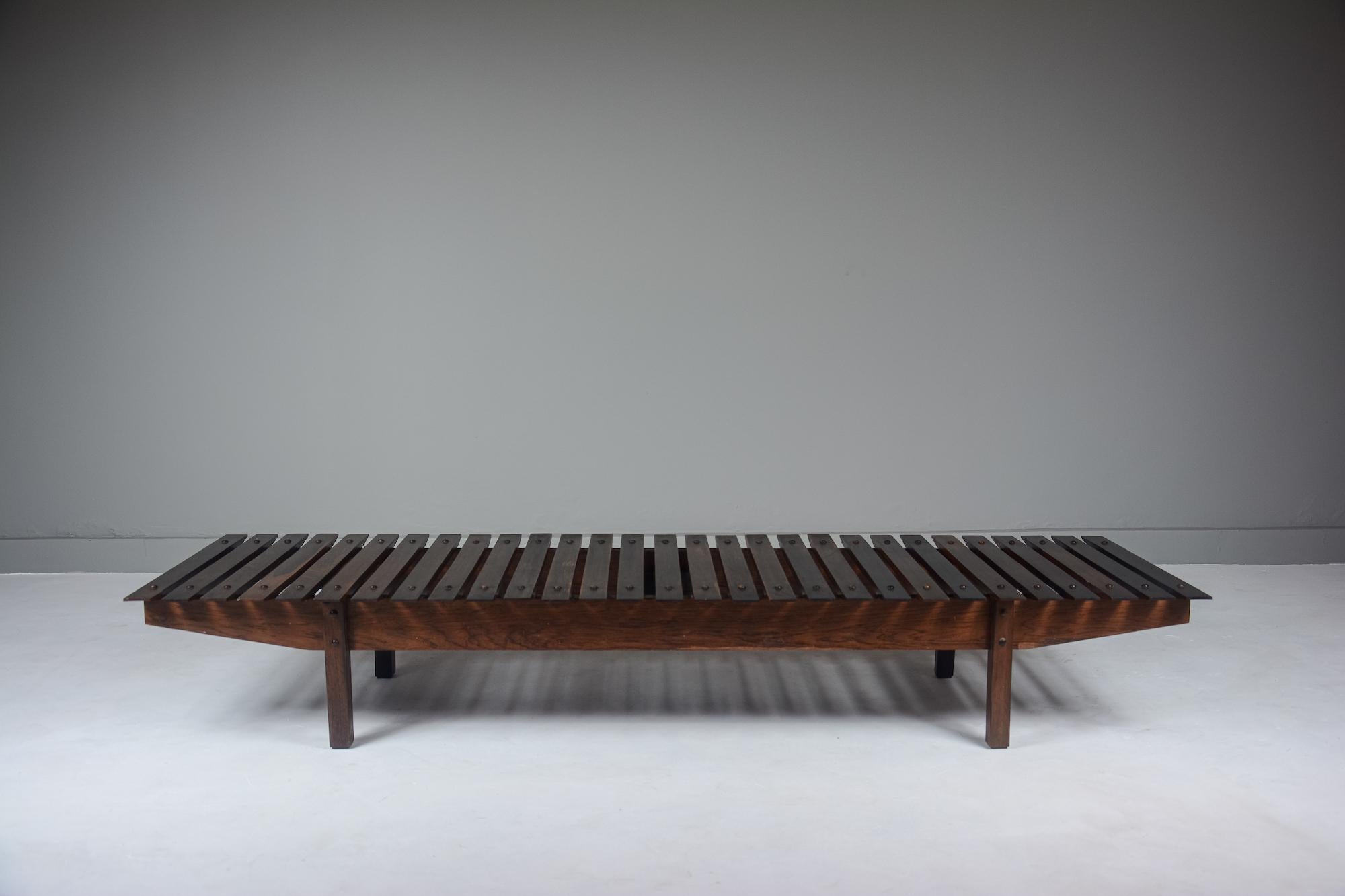 Mucki Bench in solid jacarandá. Very good overall condition. Time patina as supposed. 
One of the first pieces designed by Sergio Rodrigues, 