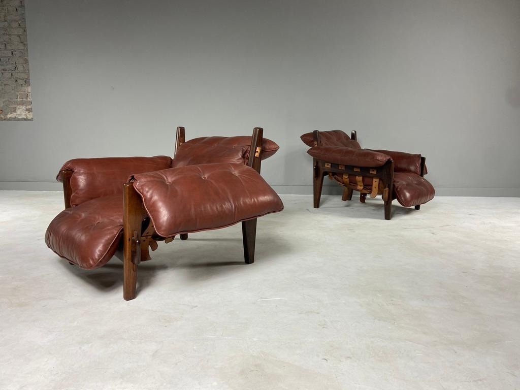 Pair of Moleca armchair made in jacaranda and leather. 

Both wood and leather have beautiful time patina. The leather condition is very good. The wood structure is in perfect condition. No details. All jacaranda buttons are available.
