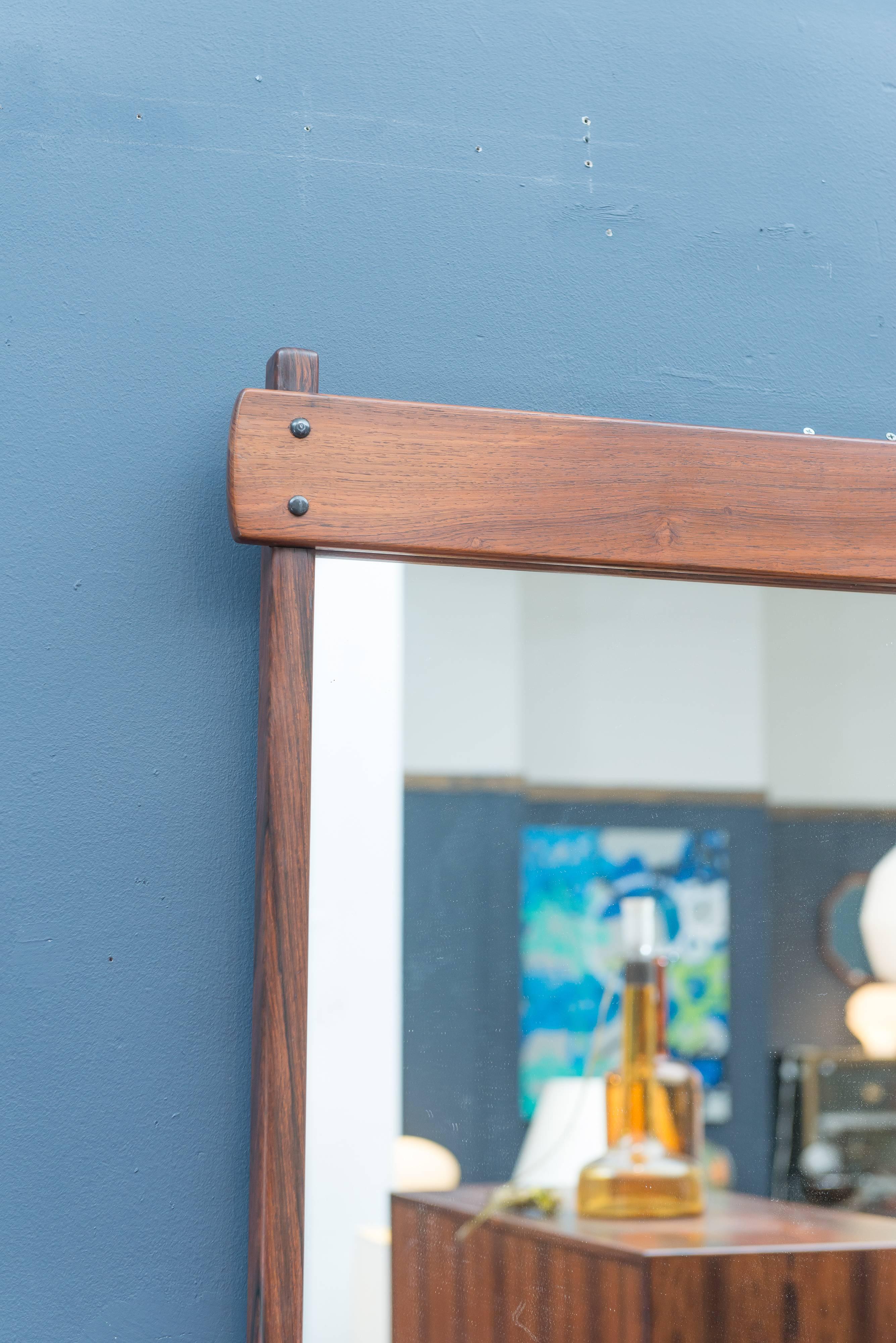 Sergio Rodrigues design wall mirror. Superb quality construction made from solid Brazilian rosewood in excellent condition.
