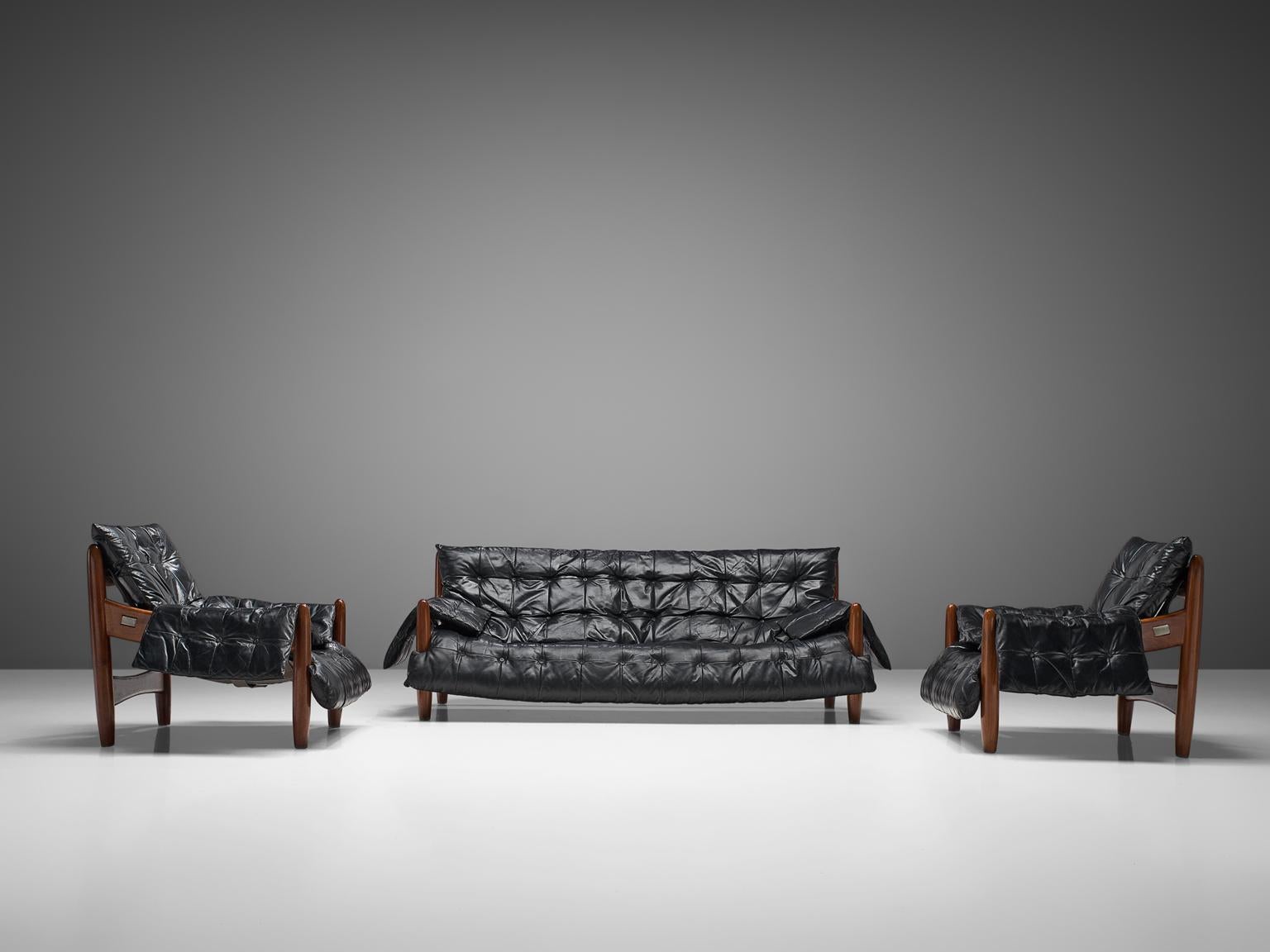 Sergio Rodrigues, 'Sheriff' sofa, black leather and Brazilian hardwood, Brazil, 1960s

Comfortable and extravagant living room set by Brazilian designer Sergio Rodrigues. These sofa and lounge chairs breath the characteristics of Brazilian modern