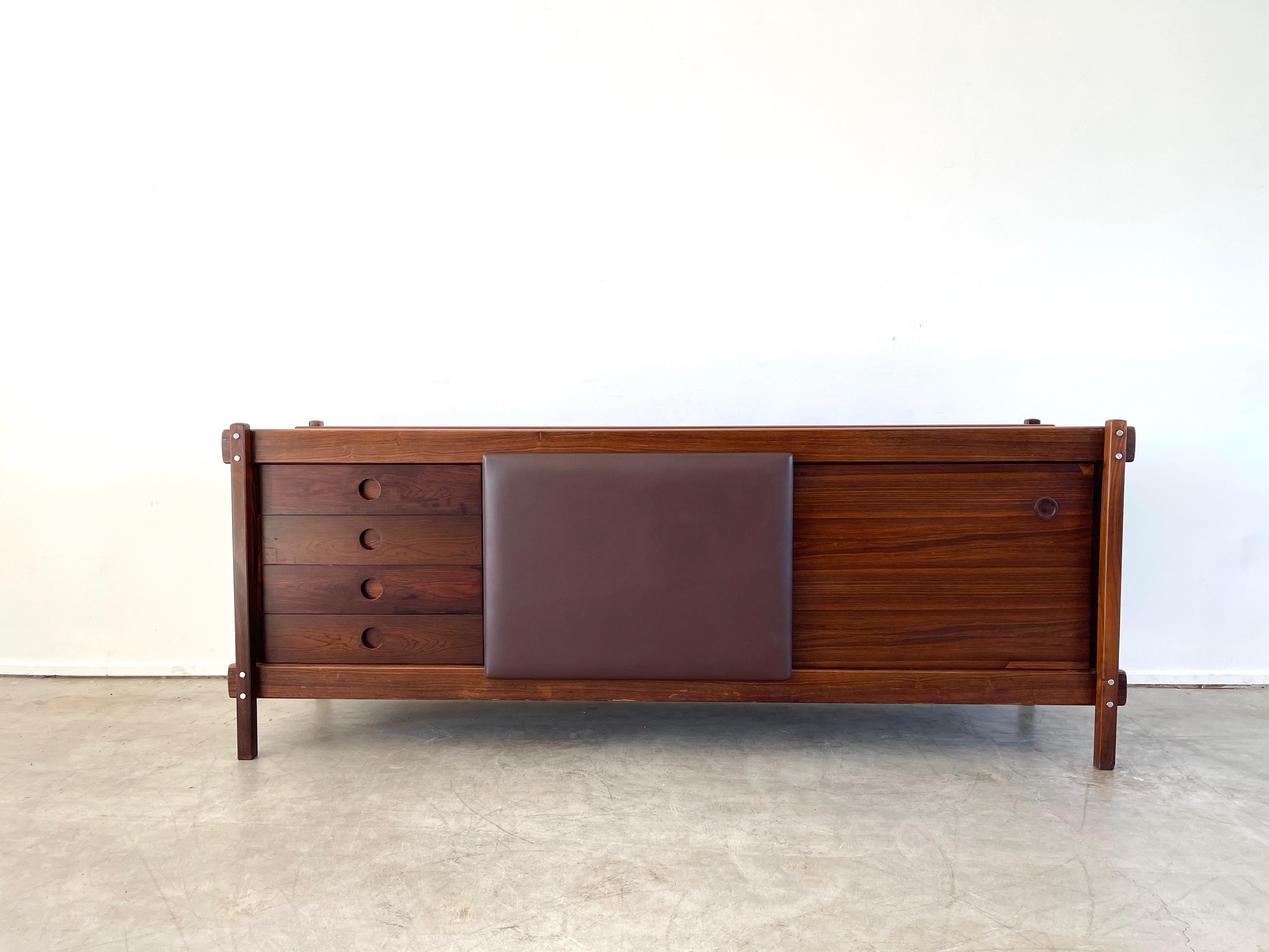 Rosewood and leather sideboard by Sergio Rodrigues, 1960's
Gorgeous rosewood with sliding leather door and 4 drawers. 
Wonderful piece.
 