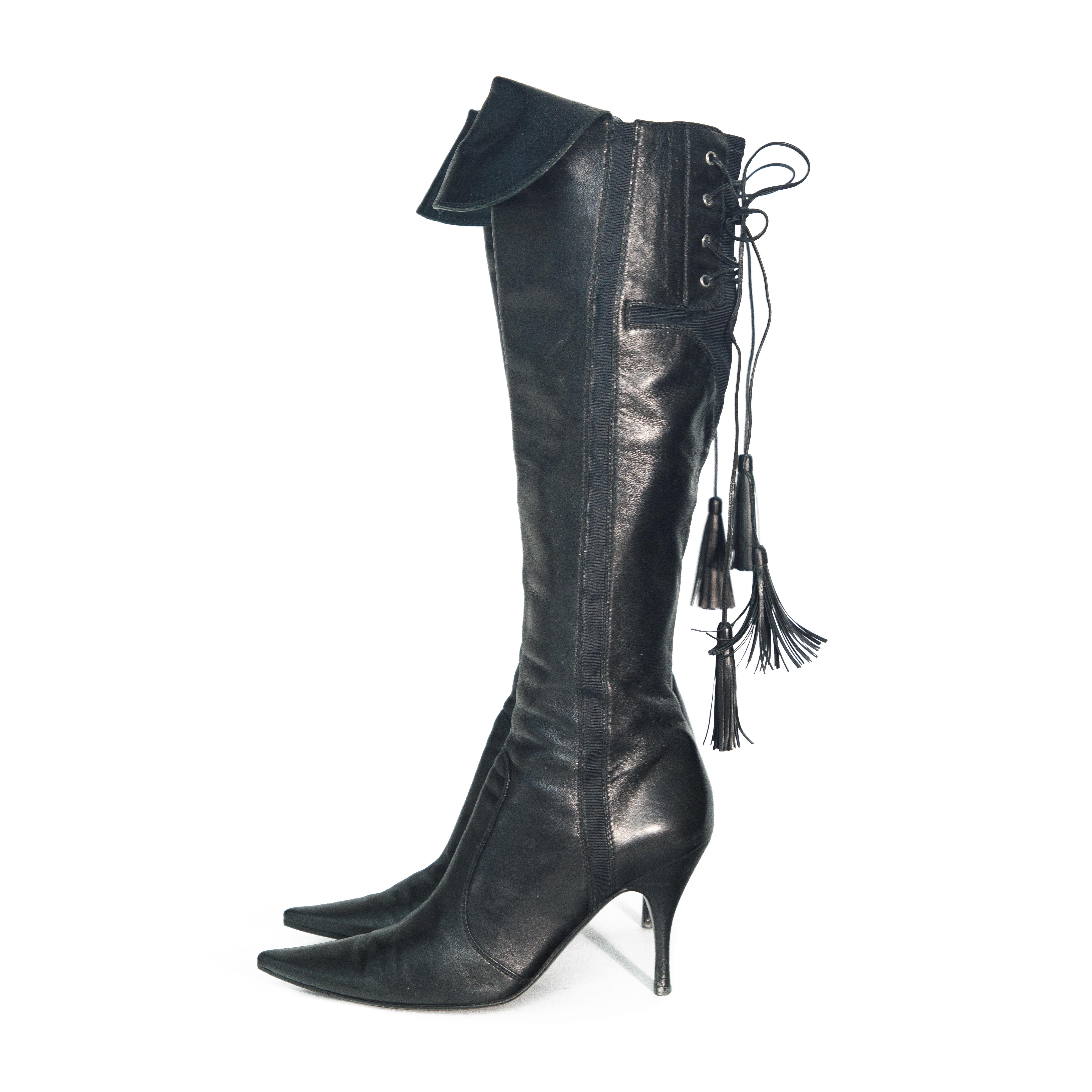 Ruder Than The Rest presents a pair of black leather pointed boots by Sergio Rossi.

Exquisite details like the corset lacing at the back.

Pirate boot fold over piece at the front.

Pointed toe.

Elastic panel at the back.

Vintage, 2008.

Made in