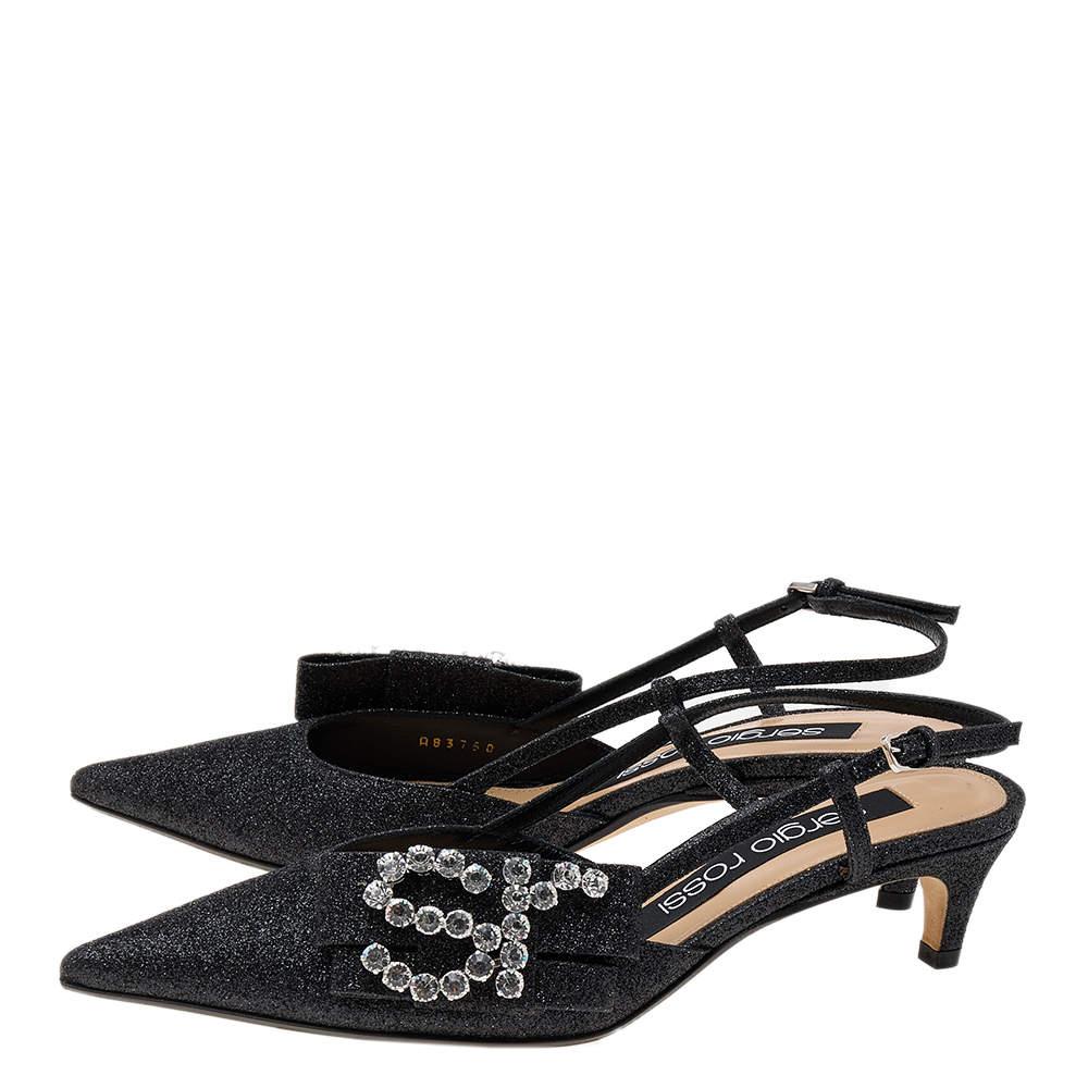 Lend an elegant finish to your look of the day with these Sergio Rossi sandals. They feature pointed toes, slingback straps, and kitten heels. The 'Sr' detailing in crystals on the bows adds the extra charm of luxury.

