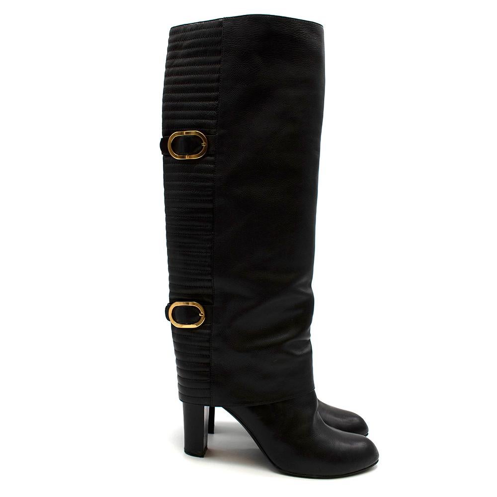 Sergio Rossi Black Leather Heeled Knee Length Boots

- Black leather 
- Heeled knee length style 
- Gold buckle detailing
- Ribbed back texture
- Rounded toe 
- Slip on style 

Materials: 
External - 100% Leather 
Internal - 100% Lamb skin