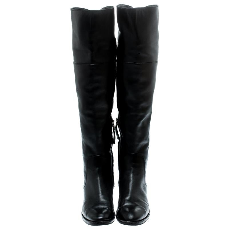 Designed in a knee-high silhouette, these high boots from Sergio Rossi feature a luxurious leather body and round toes. They are set on comfortable low heels so that you can carry them confidently all day long. Style with skinny jeans and a trench