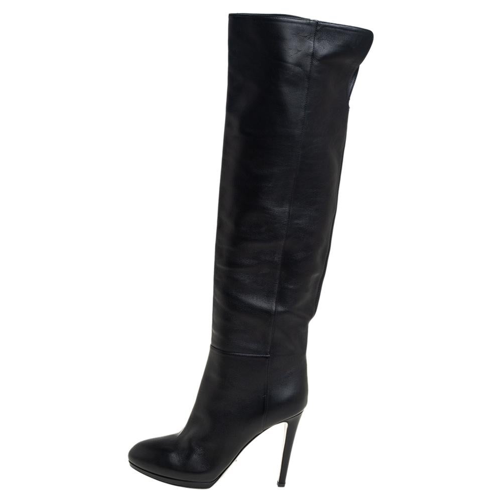 These knee-high boots from Sergio Rossi epitomize chic and effortless style. They come crafted from black leather and feature smooth toes. They are equipped with comfortable leather-lined insoles and stand tall on 11 cm heels. They will surely make