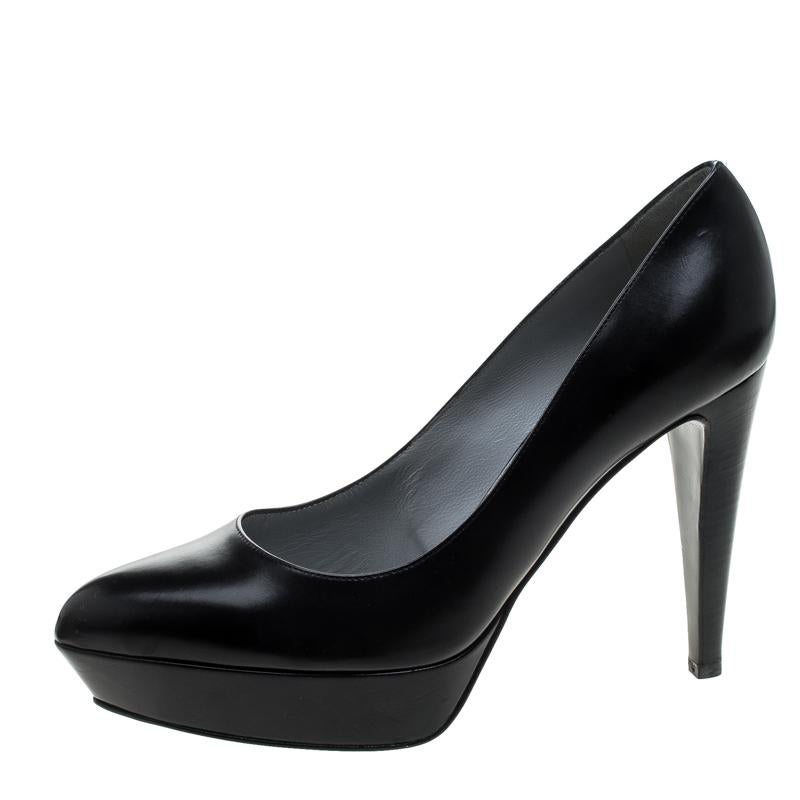 An impressive black pair to complete your look. Keep your cool this summer as you waltz around in this pair of lovely leather pumps. Boasting of comfortable platform soles, this pair of Sergio Rossi pumps is quintessential for an evening out.
