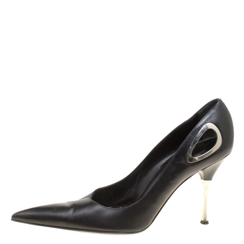 These black pumps from Sergio Rossi look very chic, classy and stylish. They are crafted from leather and feature pointed toes, a silver-tone hardware detailed cutout detailing, comfortable leather lined insoles and 9.5 cm heels. Pair them with