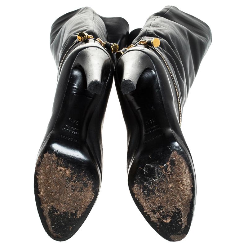 black boots with gold zipper