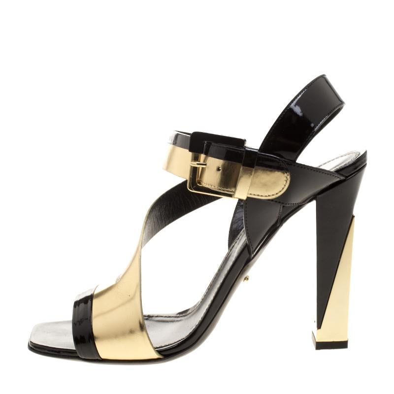 Designed with peep toes, straps, and ankle fastenings, these Sergio Rossi sandals are simply divine! They've been beautifully crafted from a combination of black and metallic gold leather, and balanced on 11.5 cm block heels.

Includes:Info Booklet,