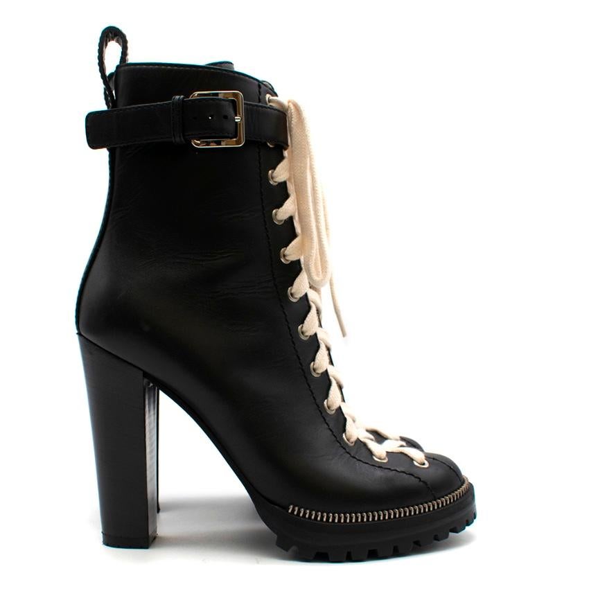 Sergio Rossi - Black leather platform ankle boots

- Ivory contrast laces - Zip up inner side - Buckle strap around the ankle - Zip teeth detailing around the toe - have been tried on - slight creasing to the the leather - small scratch on the inner